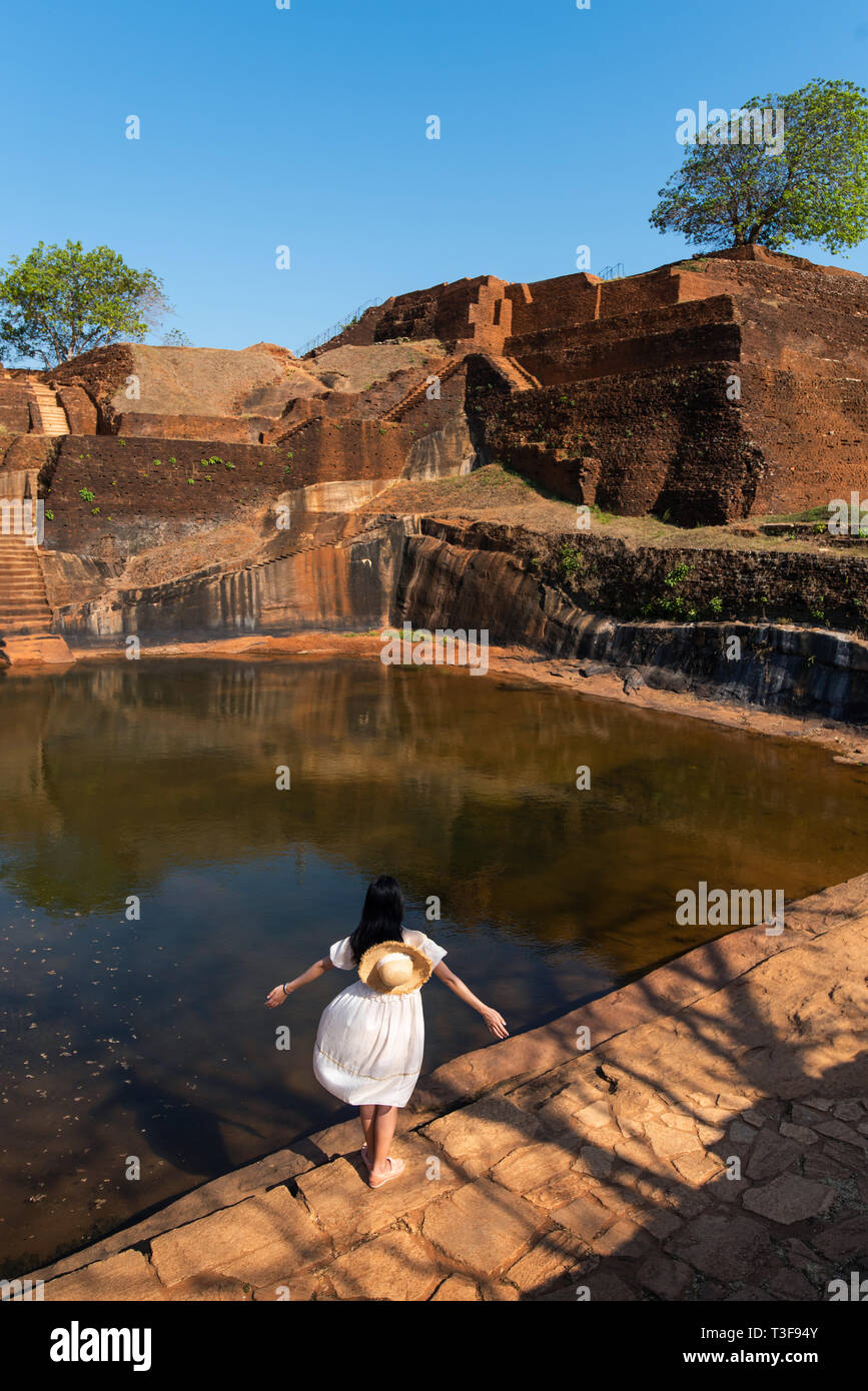 Female traveler visiting Sigiriya rock in Sri Lanka Stock Photo