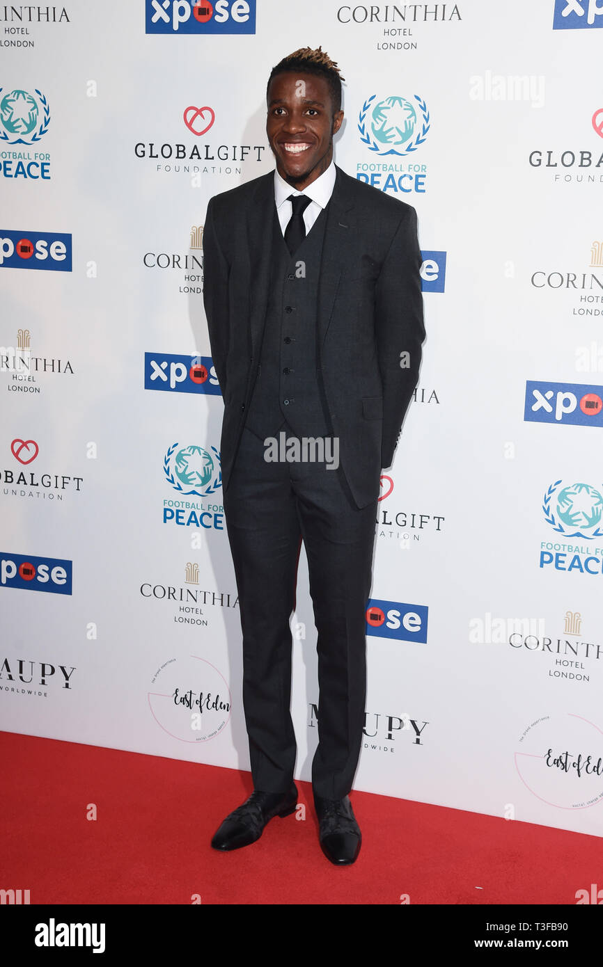 London, UK. 08th Apr, 2019. LONDON, UK. April 08, 2019: Wilfred Zaha arriving for the Football for Peace initiative dinner by Global Gift Foundation at the Corinthia Hotel, London. Picture: Steve Vas/Featureflash Credit: Paul Smith/Alamy Live News Stock Photo