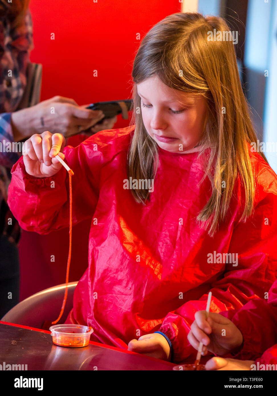 City Arts Centre, Edinburgh, Scotland, United Kingdom, 9 April 2019. Edinburgh Science Festival:  India, age 8 years, has fun learning about blood at the Blood Bar drop in event at the Science Festival Stock Photo
