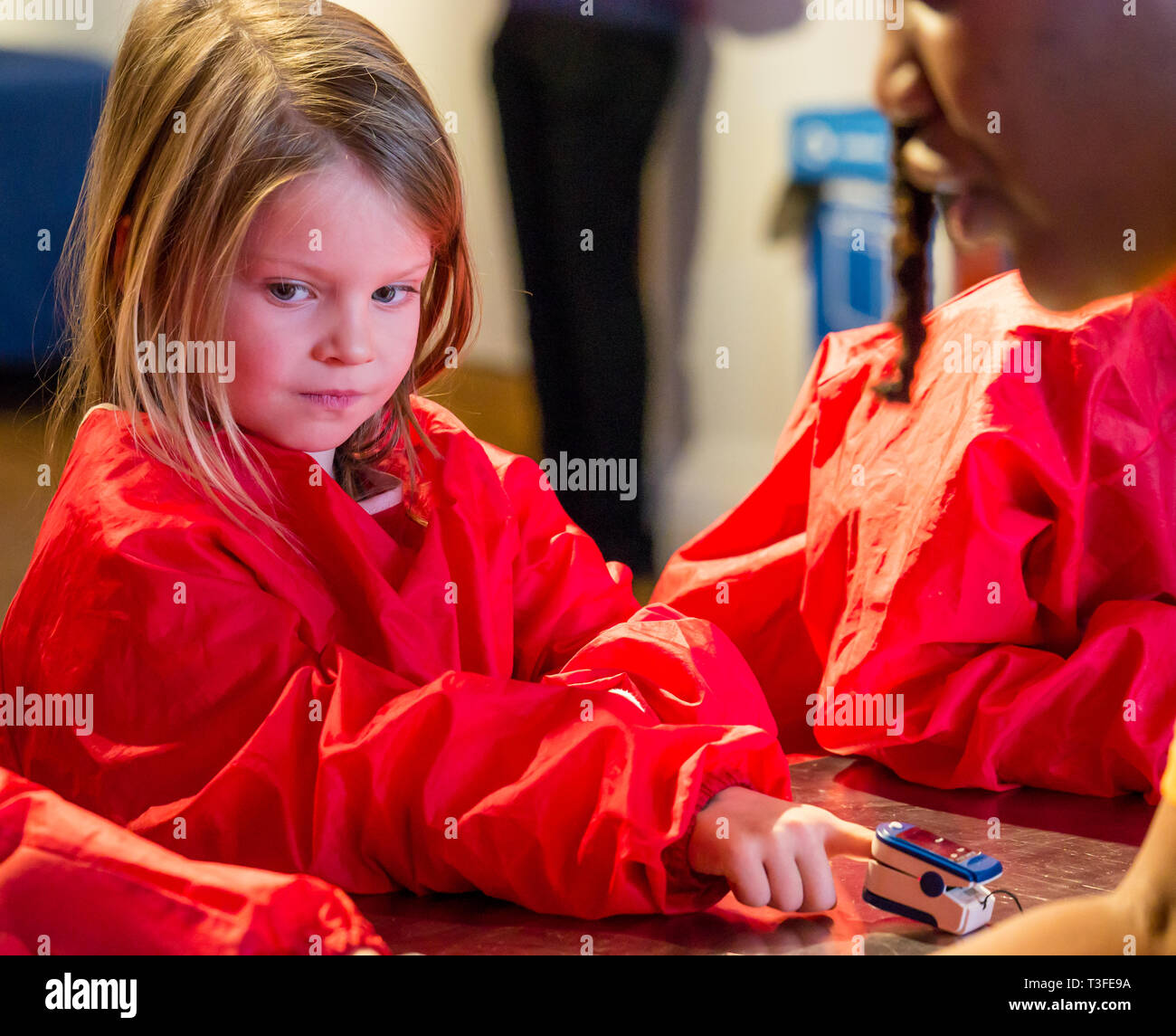 City Arts Centre, Edinburgh, Scotland, United Kingdom, 9 April 2019. Edinburgh Science Festival:  Evie, age 6 years, has fun learning about blood at the Blood Bar drop in event at the Science Festival Stock Photo