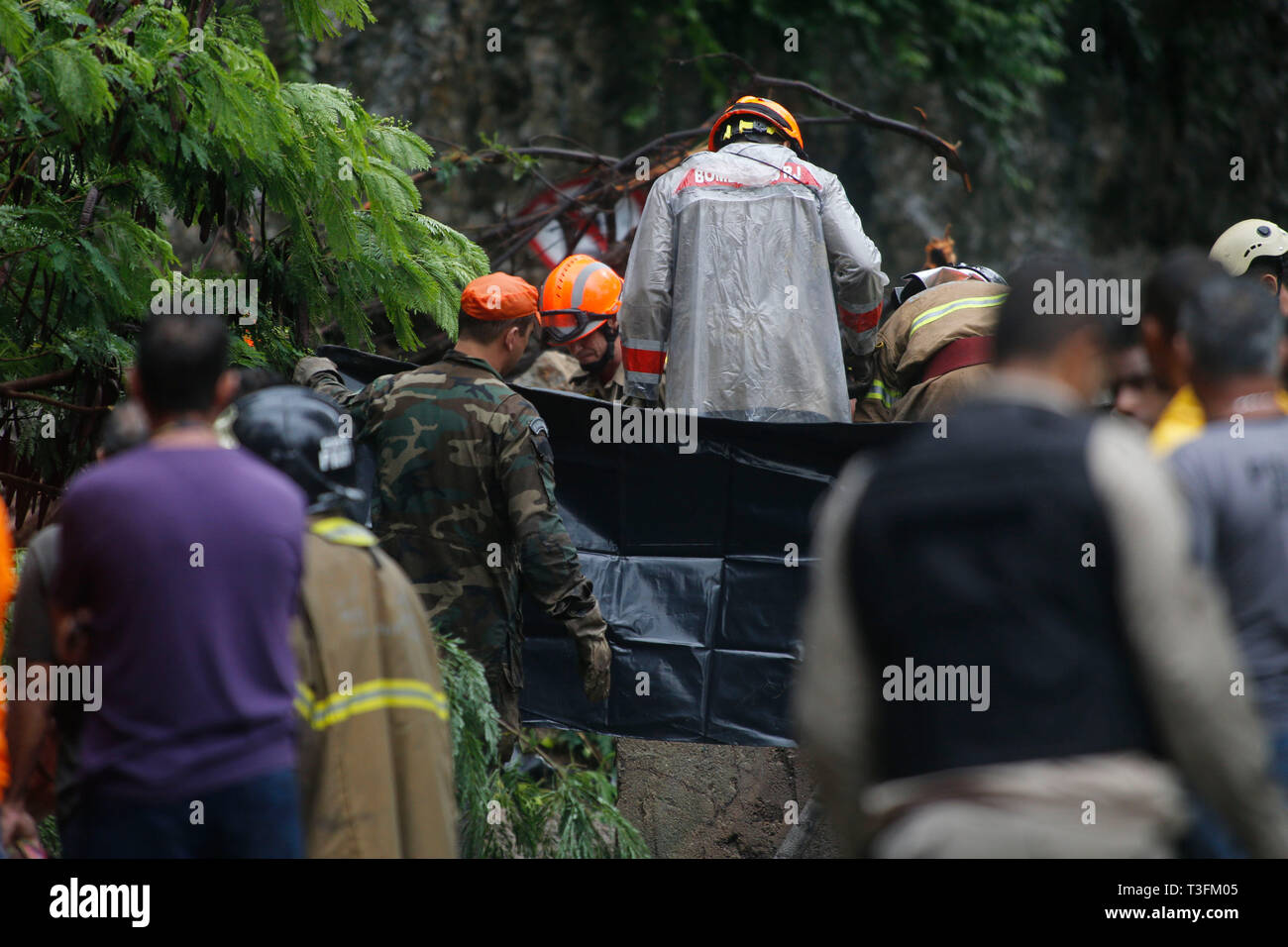 Rio de Janeiro, Brazil . 09th Apr, 2019.  Rain victims in Rio - The Fire Department rescued three bodies found today in a car buried in Botafogo in the south of Rio after the landslide caused by heavy rains that hit the city. The victims are of a taxi driver, an avo and his granddaughter who leave a mall in the south zone of the city. Credit: AGIF/Alamy Live News Stock Photo