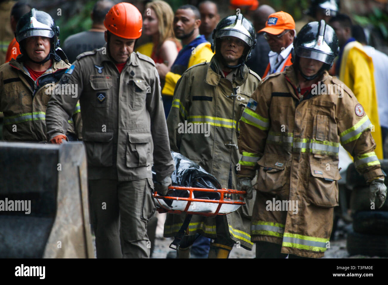 Rio de Janeiro, Brazil . 09th Apr, 2019.  Rain victims in Rio - The Fire Department rescued three bodies found today in a car buried in Botafogo in the south of Rio after the landslide caused by heavy rains that hit the city. The victims are of a taxi driver, an avo and his granddaughter who leave a mall in the south zone of the city. Credit: AGIF/Alamy Live News Stock Photo