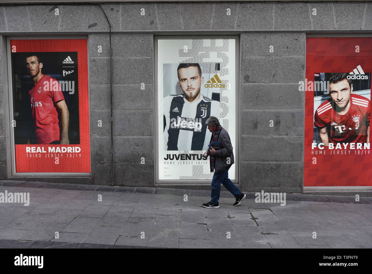 Madrid, Madrid, Spain. 9th Apr, 2019. A man seen walking next to An Adidas  Advertisement on a Adidas store in Madrid. Credit: John Milner/SOPA  Images/ZUMA Wire/Alamy Live News Stock Photo - Alamy