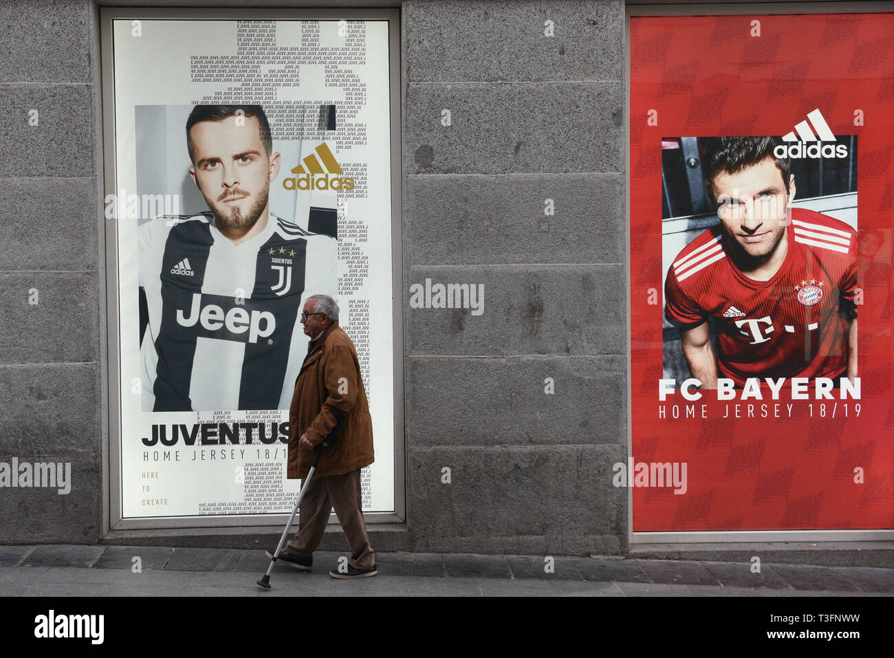 Madrid, Madrid, Spain. 9th Apr, 2019. A man seen walking next to An Adidas  Advertisement on a Adidas store in Madrid. Credit: John Milner/SOPA  Images/ZUMA Wire/Alamy Live News Stock Photo - Alamy