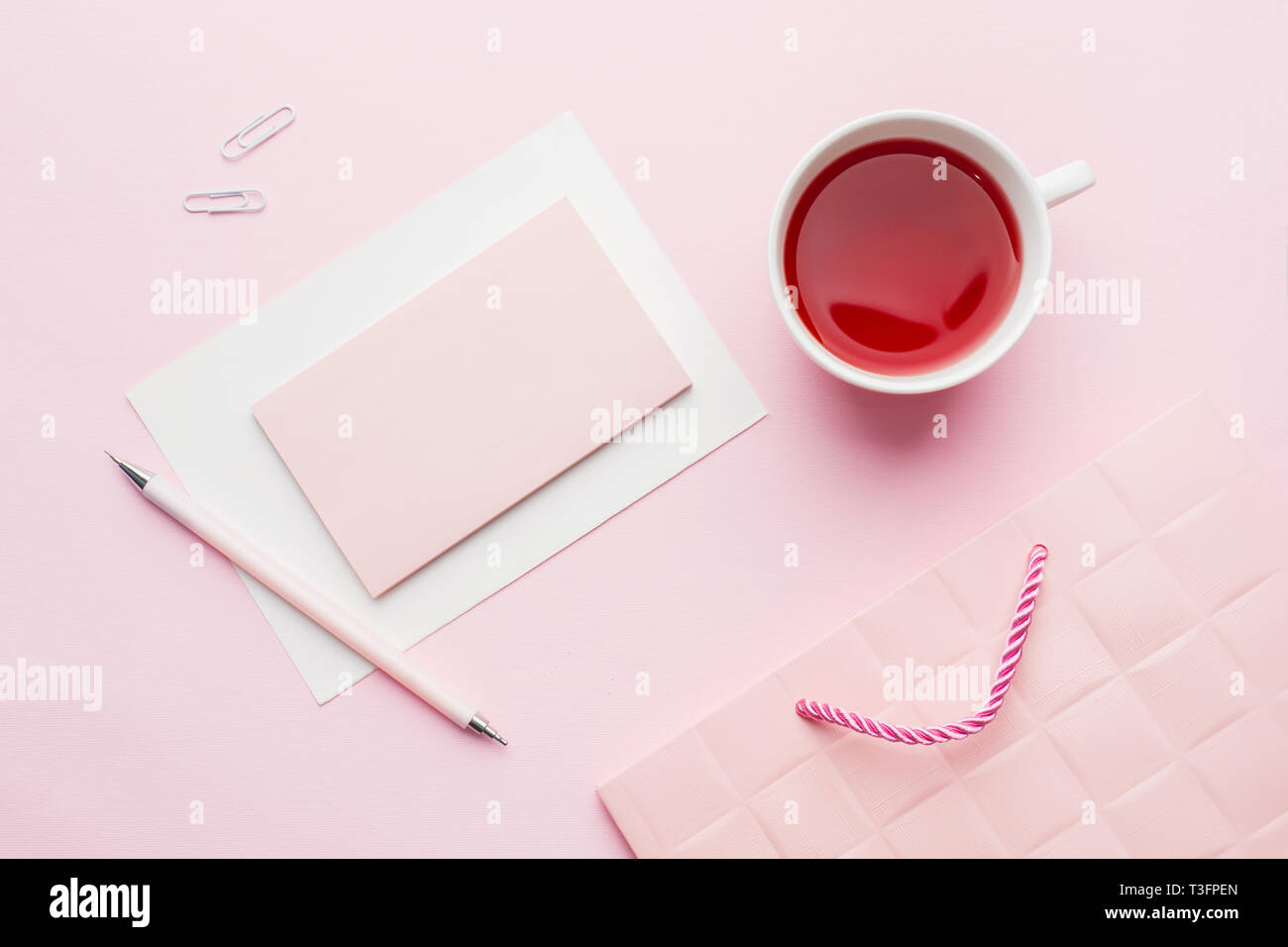 Red Pink Object Red-pink objects. Cup of tea and Notepad for text on pastel pink ...