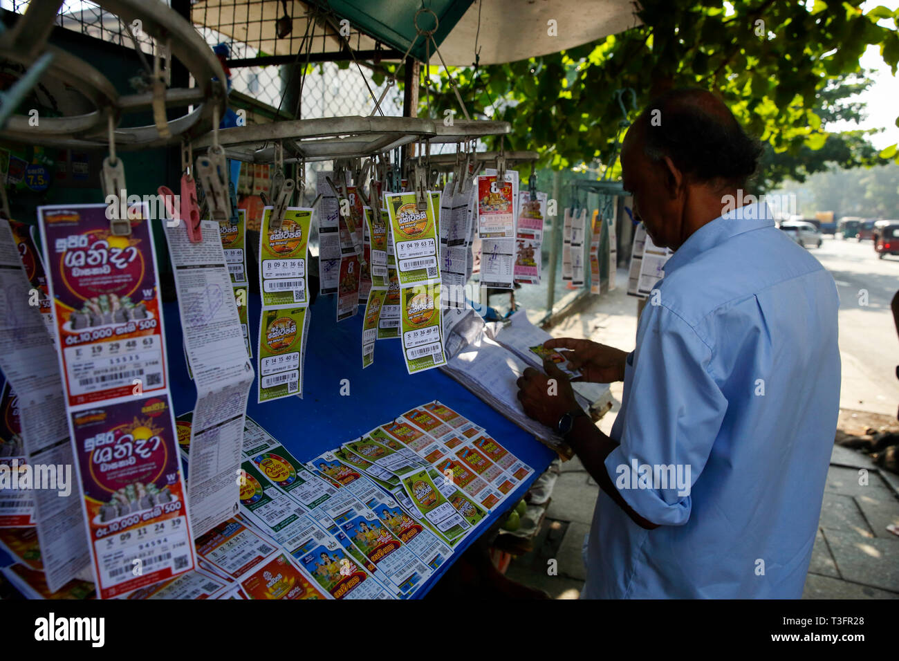 A lottery vendor at his kiosk at Colombo, Sri Lanka Stock Photo