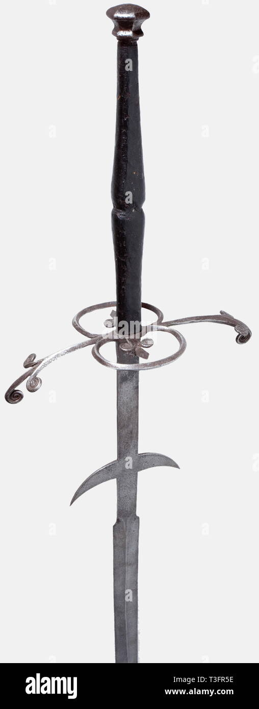 A German two-hand sword, circa 1580 Heavily restored blade with long ricassos and fluke-shaped lugs. Iron hilt, The ridged quillons have decorative rolled split finials. Large guard rings on each side with an inserted fleur de lys. Leather-covered grip. Hexagonal, iron pommel, not original. Length 172 cm. Decorative weapon, composed from old pieces. historic, historical, 16th century, sword, swords, weapons, arms, weapon, arm, fighting device, military, militaria, object, objects, stills, clipping, clippings, cut out, cut-out, cut-outs, melee wea, Additional-Rights-Clearance-Info-Not-Available Stock Photo