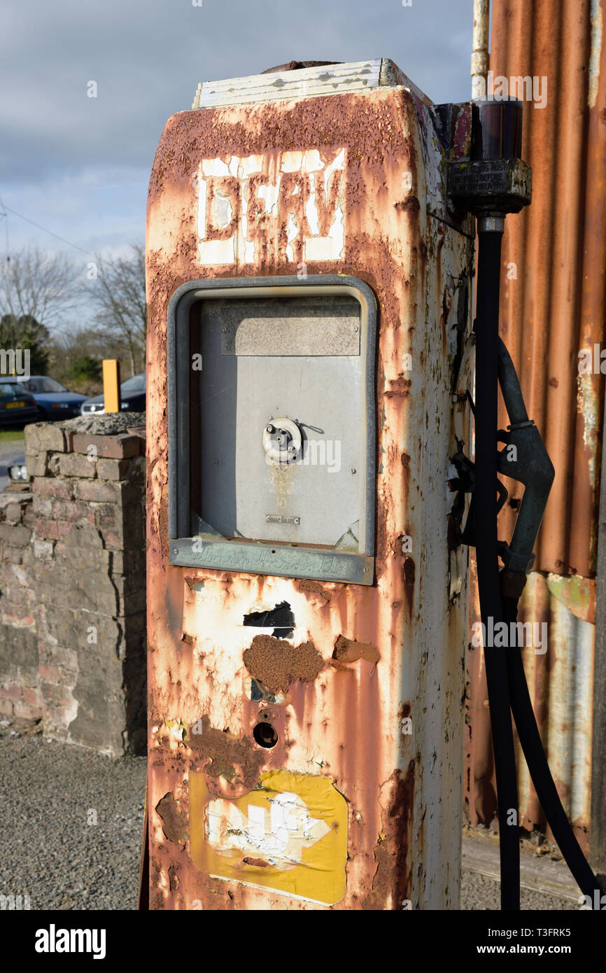 Old derelict rusty diesel pump in north wales uk Stock Photo