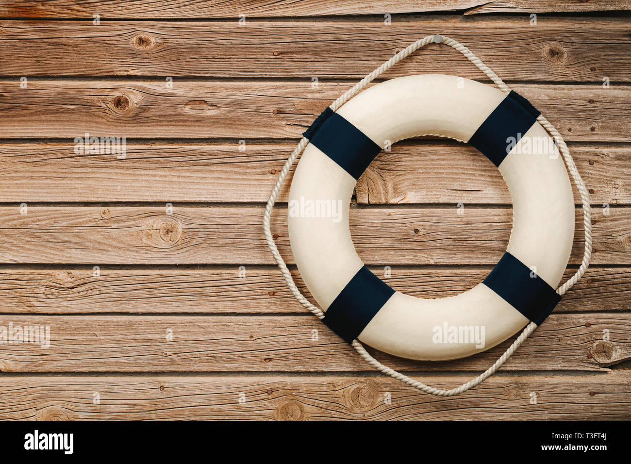 Close up of life buoy on the wooden background with copy space Stock Photo