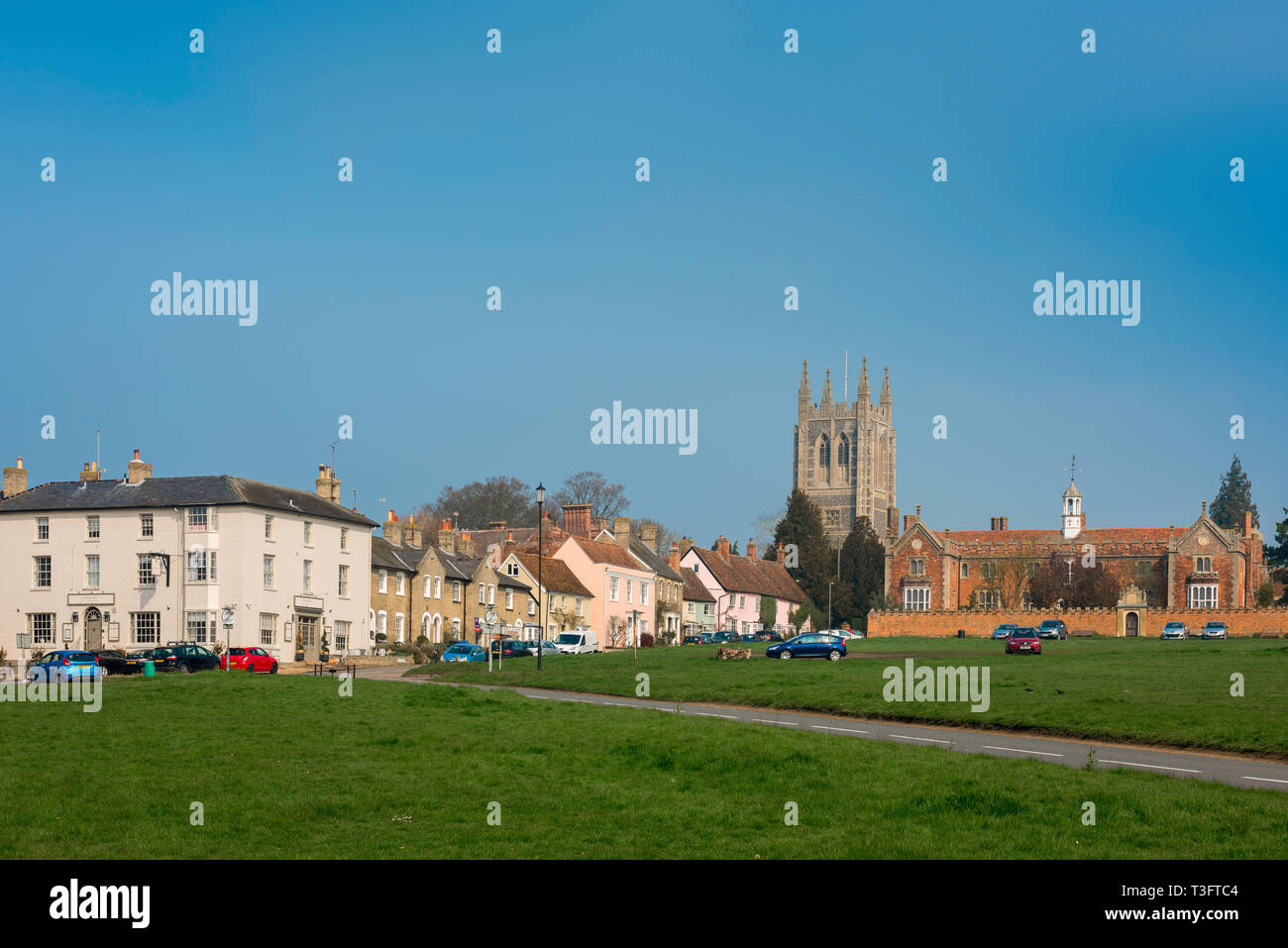 Long Melford Suffolk, view of The Green, the tower of Holy Trinity Church and Tudor hospital (right) in Long Melford village, Suffolk, England, UK. Stock Photo