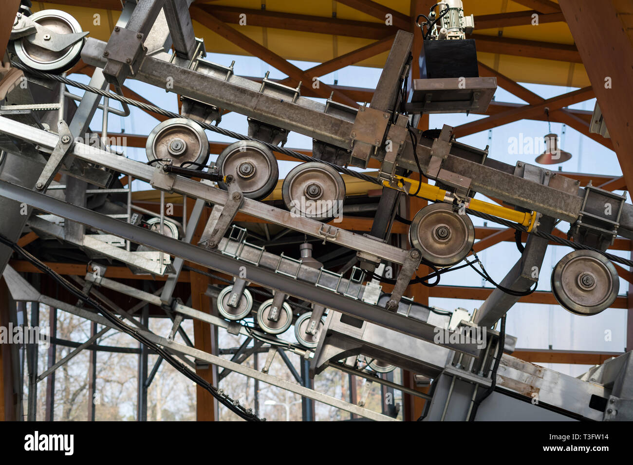 Metal funicular mechanism with rotating wheels. Lifting elevator to the