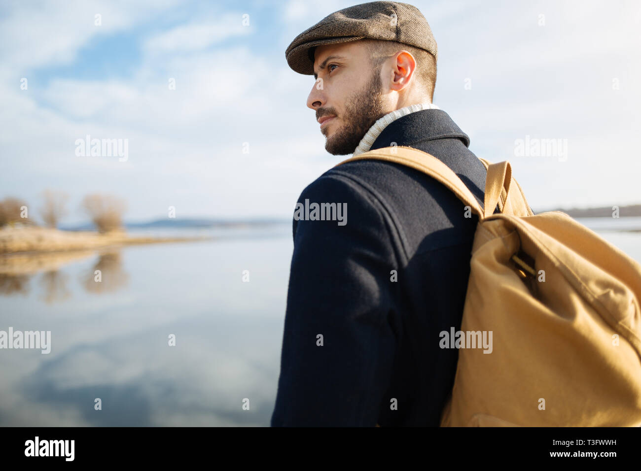 Bearded man with old fashion dress and ivy cap outdoor Stock Photo - Alamy