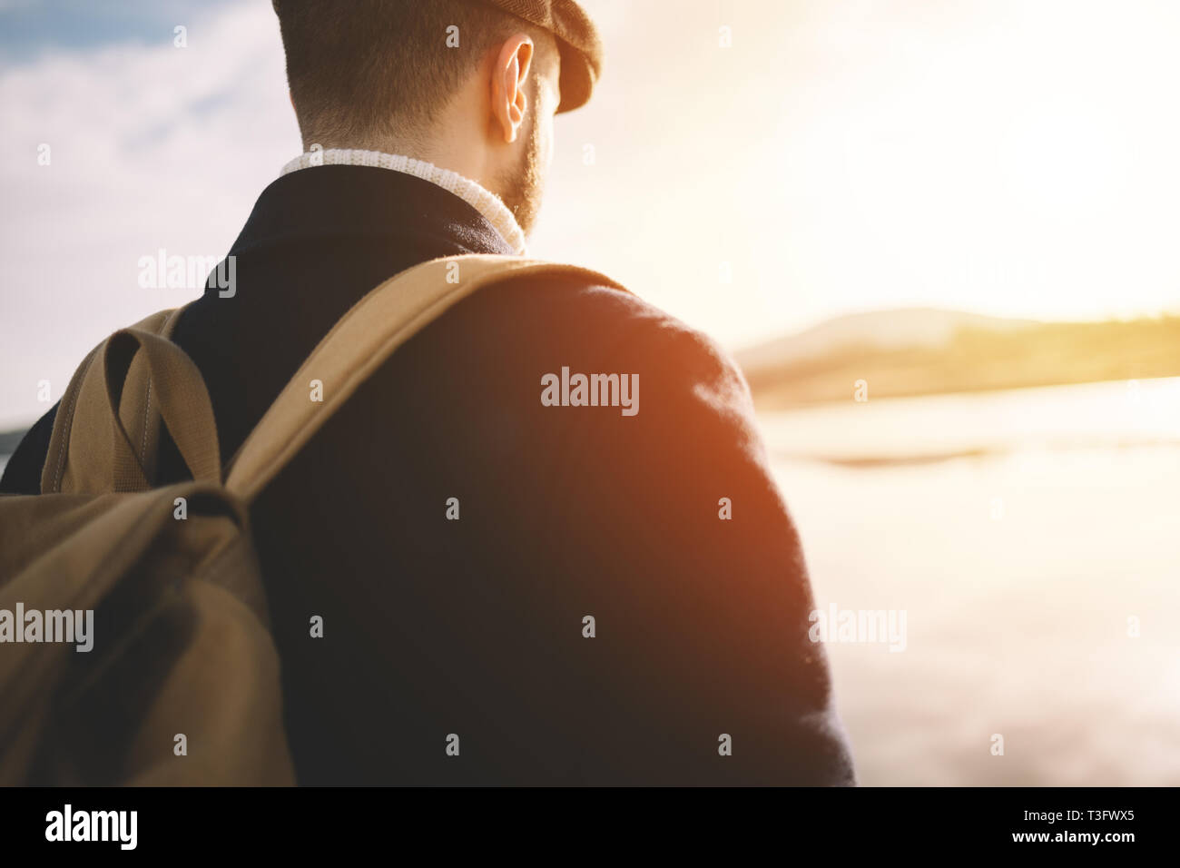 Bearded man with old fashion dress and ivy cap outdoor Stock Photo - Alamy