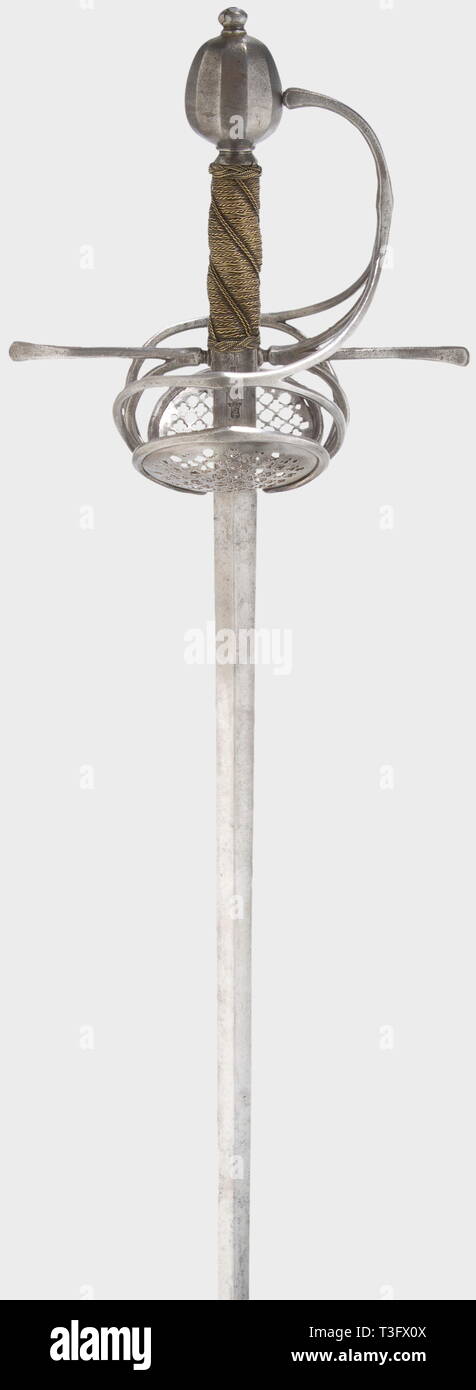 A swept-hilt rapier of Pappenheim type, Germany, circa 1630 Slender double-edged thrusting blade of diamond section and a Toledo mark struck twice at the ricasso on both sides. Chiselled iron swept hilt with inset, finely pierced guards. Grip wrapping and Turk's heads of twisted brass wire. Length 118.5 cm. historic, historical, 17th century, sword, swords, weapons, arms, weapon, arm, fighting device, military, militaria, object, objects, stills, clipping, clippings, cut out, cut-out, cut-outs, melee weapon, melee weapons, metal, Additional-Rights-Clearance-Info-Not-Available Stock Photo
