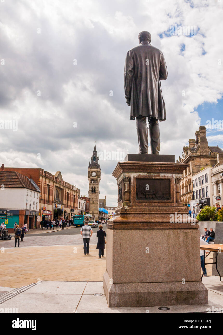 Statue of Joseph Pease at the junction of High Row and Bondgate in Darlington looking towards the Town Clock he gave the town Stock Photo