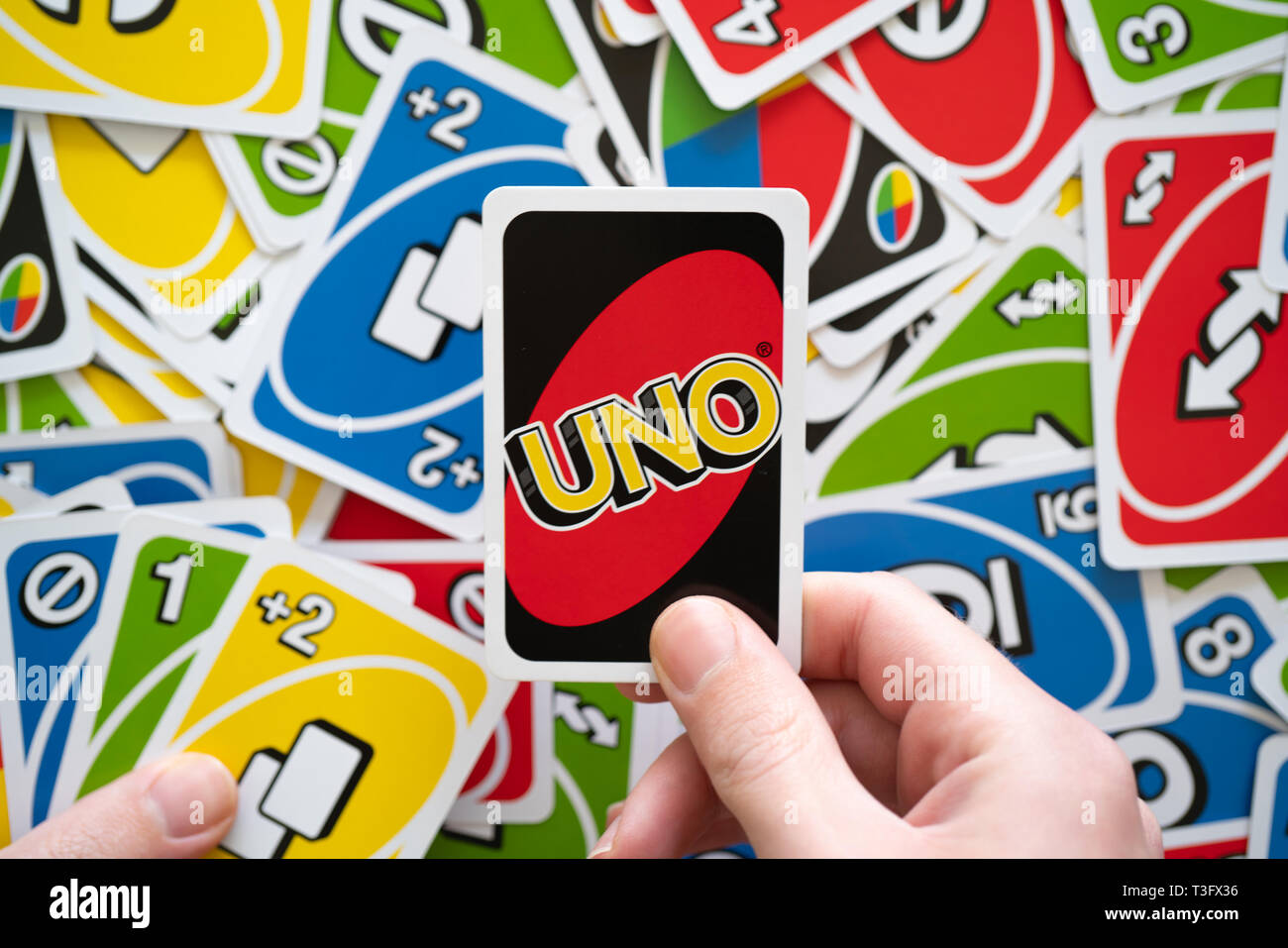 Download A Bright Yellow Reverse Uno Card Wallpaper