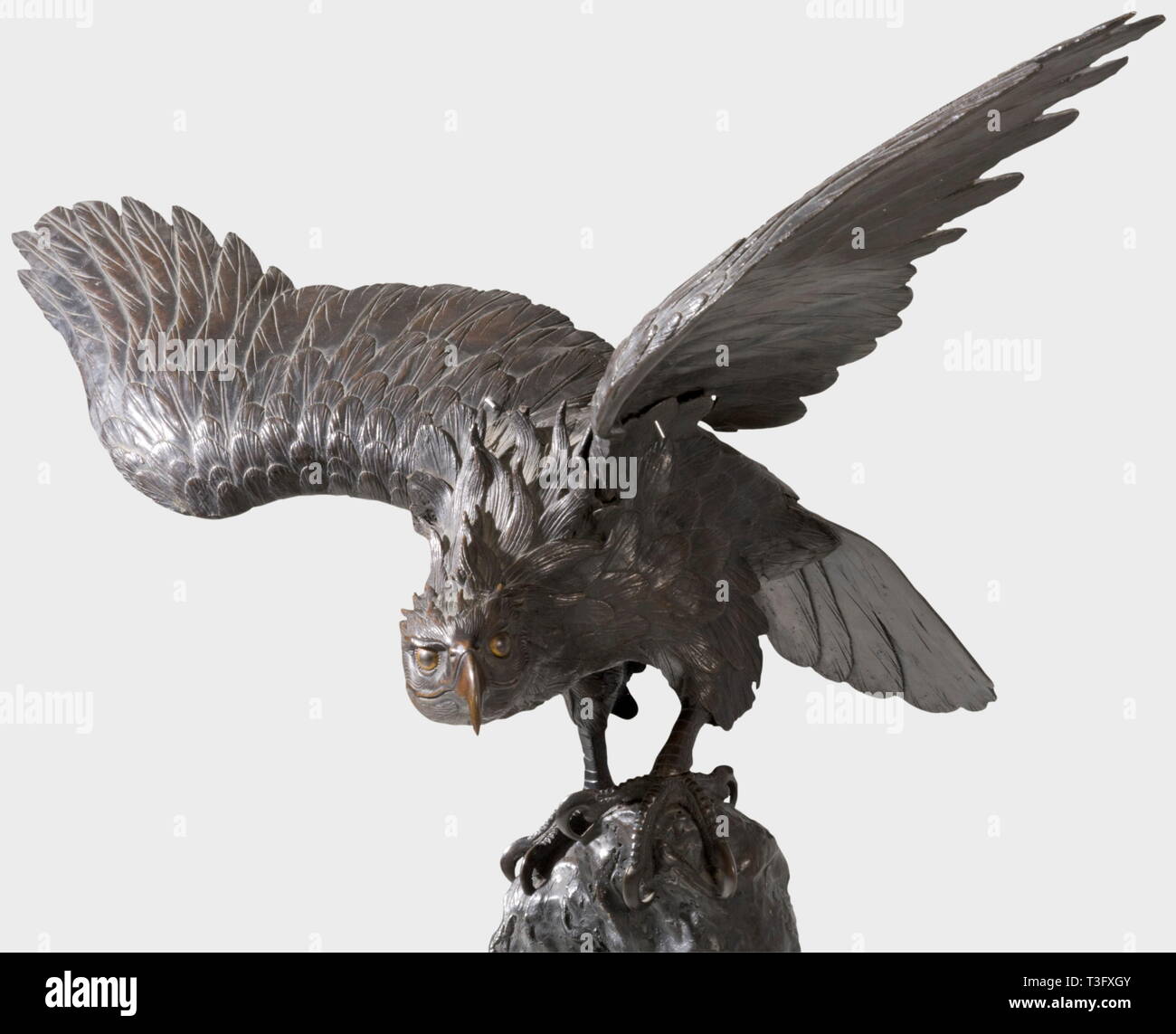 An eagle taking flight, Bronze sculpture, Japan, 2nd half of the 19th century. Eagle with spread wings perched on a rock. Dark patinated bronze cast, made of several parts, very finely worked. Height 76 cm, wing span 83 cm. Wing tips slightly damaged, tail slightly bent. Unsigned. historic, historical, 19th century, Japanese, Asian, Asia, Far East, object, objects, stills, clipping, clippings, cut out, cut-out, cut-outs, sculpture, sculptures, statuette, figurine, figurines, statuettes, fine arts, art, Additional-Rights-Clearance-Info-Not-Available Stock Photo
