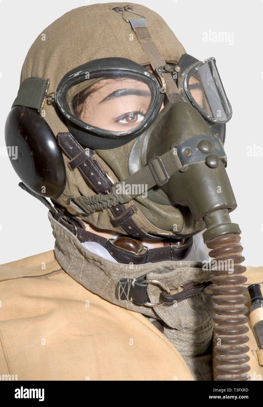 A pilot's uniform ensemble, during the aerial bombing of England, 1940 - 44 A pilot's helmet of sand-coloured linen with brown leather pieces in the very rare early version with the throat microphone on the side, type Siemens Lkp 100, Fl 31216, complete with cable and connector plug. Summer flying suit of sand-coloured linen ('Prym' buttons, 'Zipp' or Rheinnädel' zippers, repairs in places). Pilot's white silk scarf. Dark leather, fur-lined flying boots, early model with two zippers (repaired in places). Long, brown leather, pilot's historic, historical, people, 1930s, 20th, Editorial-Use-Only Stock Photo