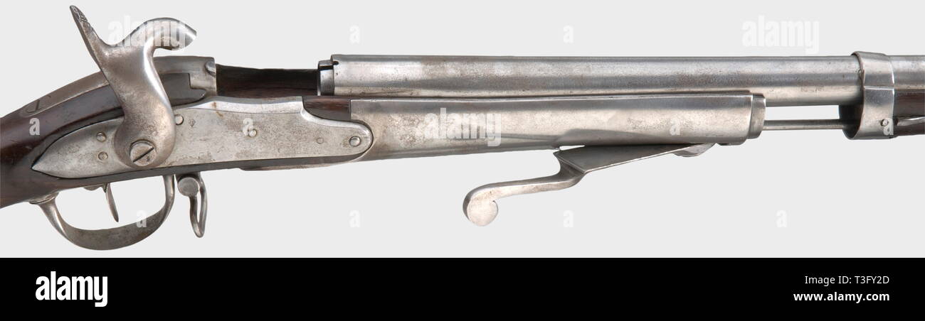 A pin-fire trial rifle, on the basis of the infantry rifle M 1822. Smooth bore in calibre 17 mm. Smooth, converted lock with acceptance stamp. Full walnut stock with iron mounting. Massive receiver with loading lever in front of trigger guard. Iron ramrod (not belonging?). Iron parts cleaned and minimally pitty in places, stock with light marks of use, crack under the barrel. Length 135 cm. Interesting attempt to design a field-efficient breech loader. Erwerbsscheinpflichtig. historic, historical, 19th century, firearm, fire arm, gun, fire arms, , Additional-Rights-Clearance-Info-Not-Available Stock Photo