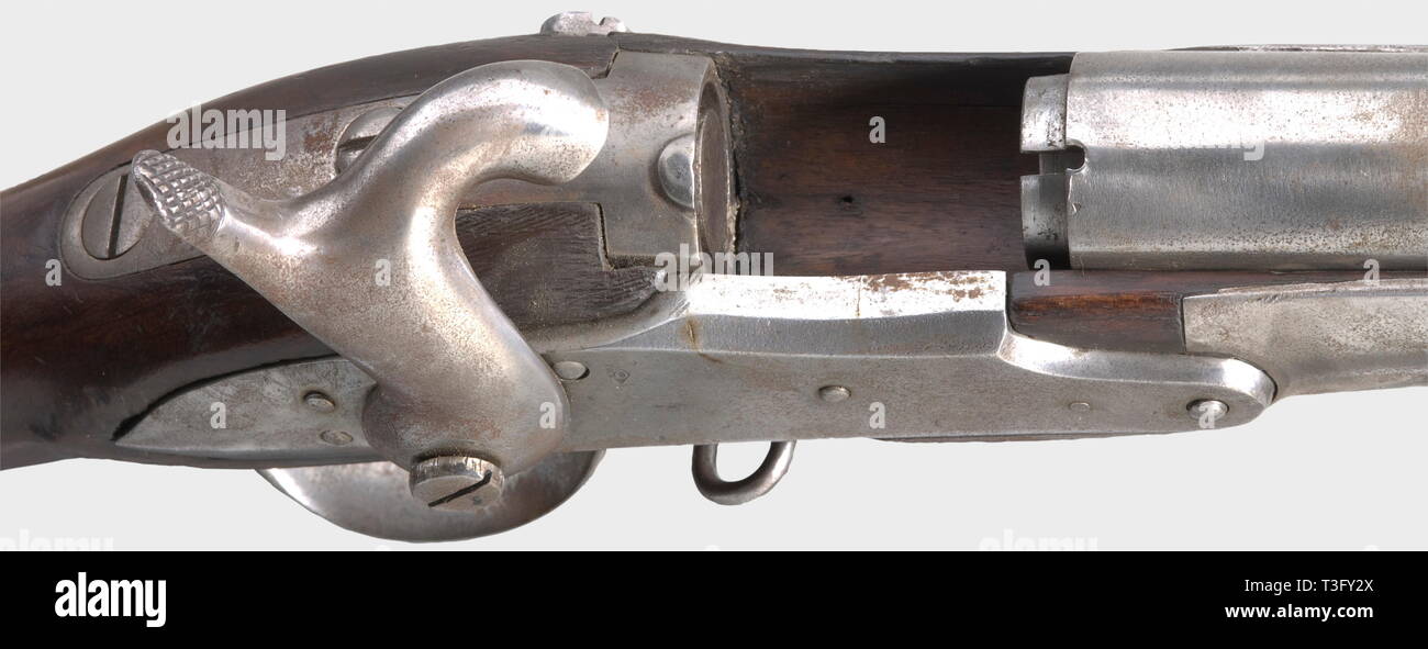 A pin-fire trial rifle, on the basis of the infantry rifle M 1822. Smooth bore in calibre 17 mm. Smooth, converted lock with acceptance stamp. Full walnut stock with iron mounting. Massive receiver with loading lever in front of trigger guard. Iron ramrod (not belonging?). Iron parts cleaned and minimally pitty in places, stock with light marks of use, crack under the barrel. Length 135 cm. Interesting attempt to design a field-efficient breech loader. Erwerbsscheinpflichtig. historic, historical, 19th century, firearm, fire arm, gun, fire arms, , Additional-Rights-Clearance-Info-Not-Available Stock Photo