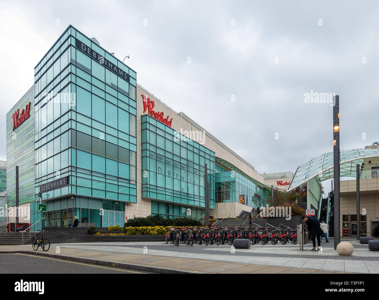 A Santander hire bike docking station outside of the Westfied Shopping  Center at white City, Shepherd's Bush, London Stock Photo - Alamy