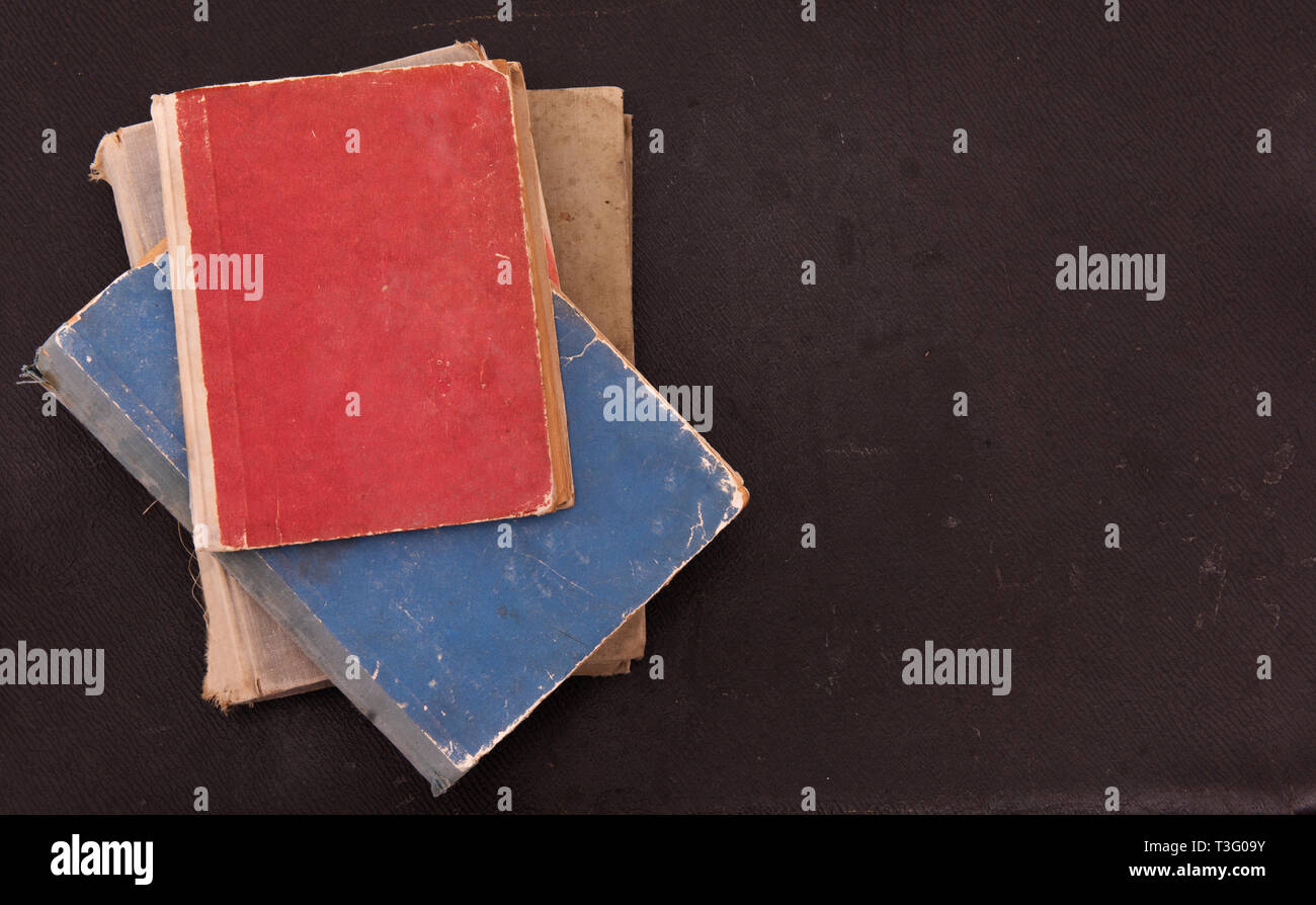 Old different books on vintage old background Stock Photo