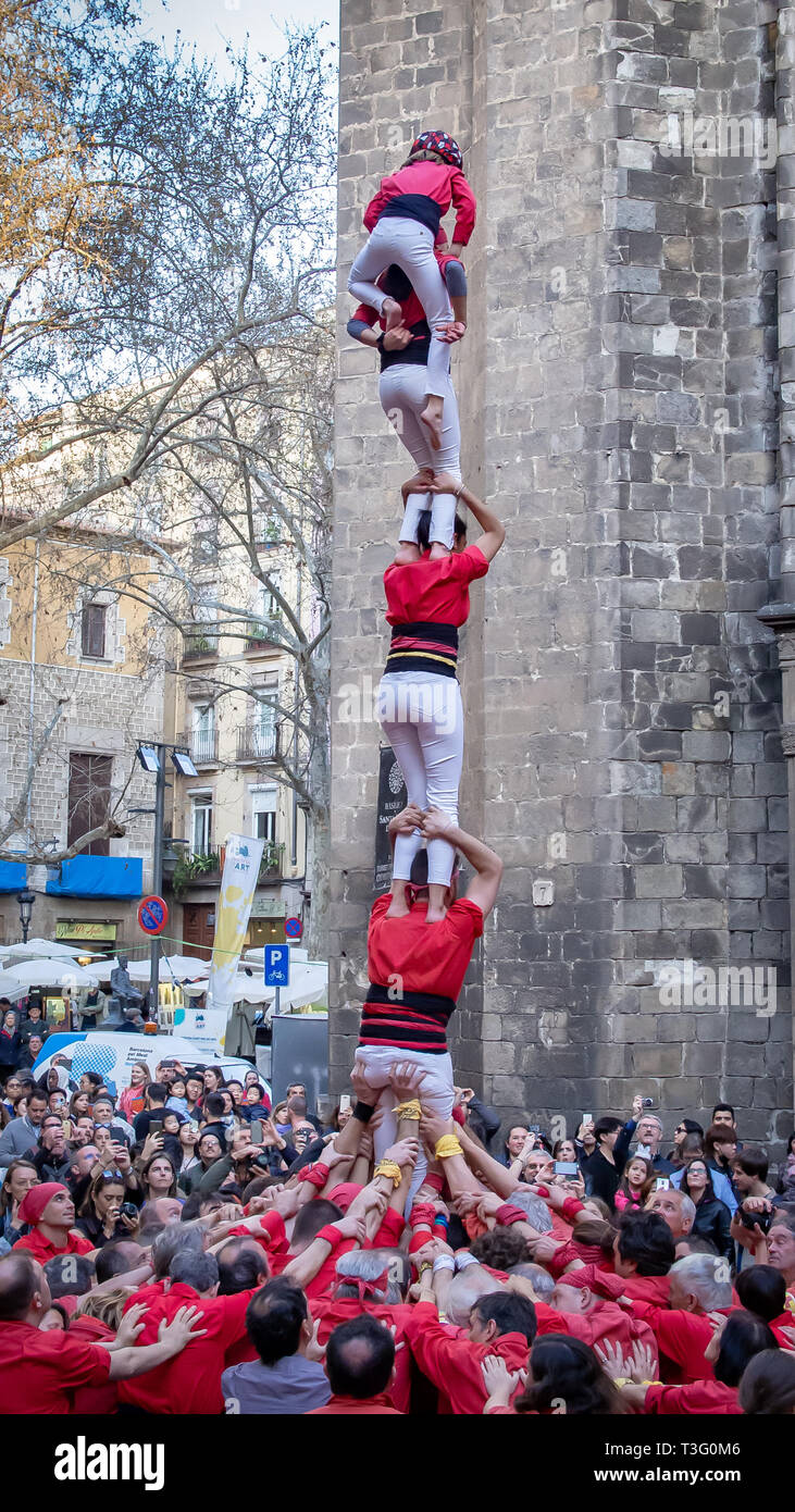 BARCELONA, SPAIN-MARCH 14, 2019: Сastellers constructing the castell (traditional catalonian human tower) Stock Photo