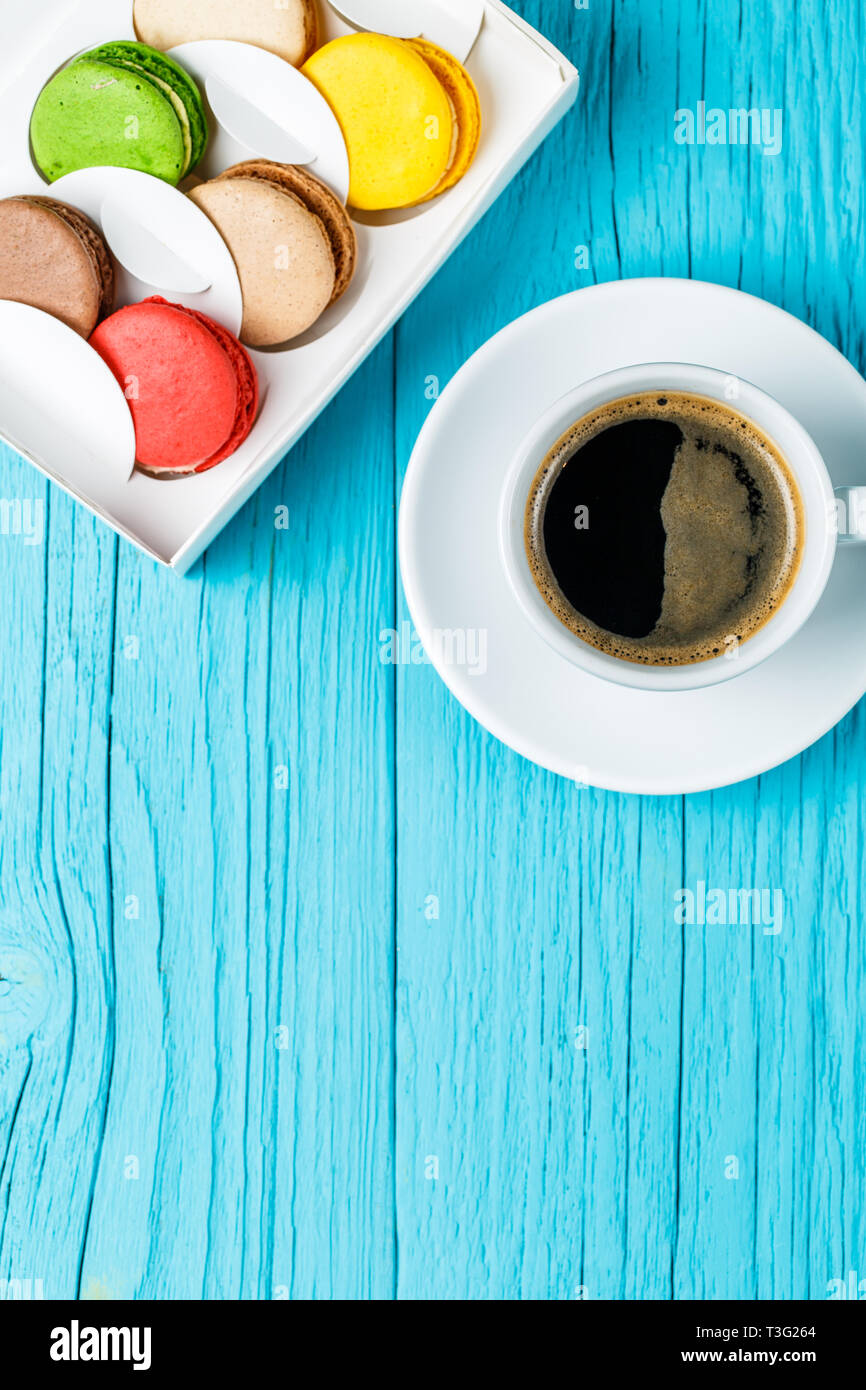 Multicolored macaroons with black coffee Stock Photo