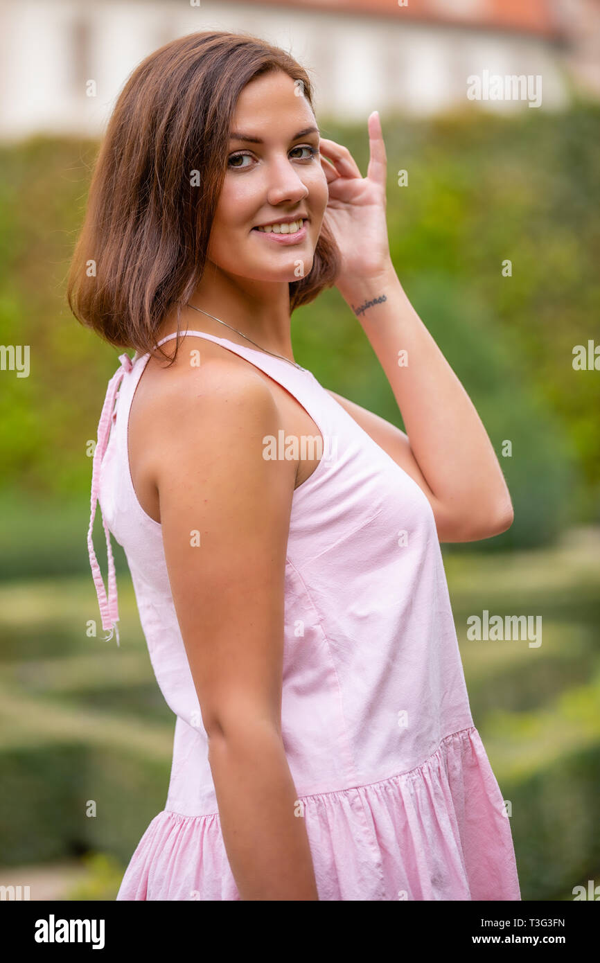 Portrait of young woman in Wallenstein garden in Prague, Czech Republic Stock Photo