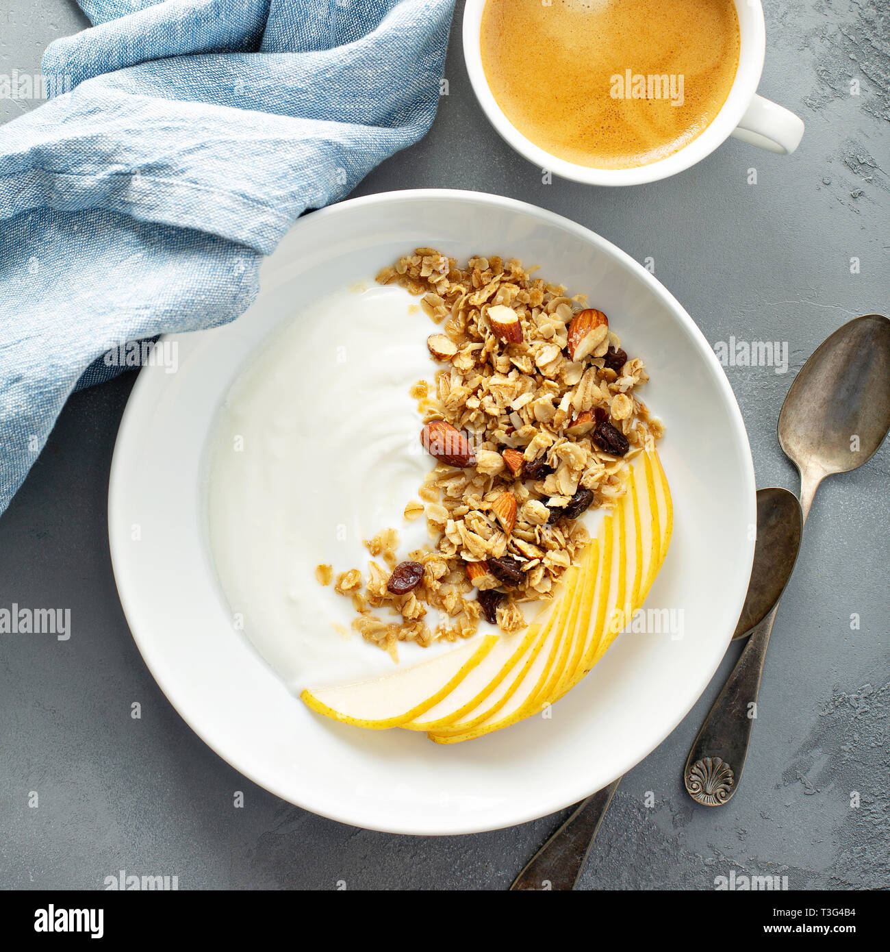Plain yogurt with granola and pear Stock Photo