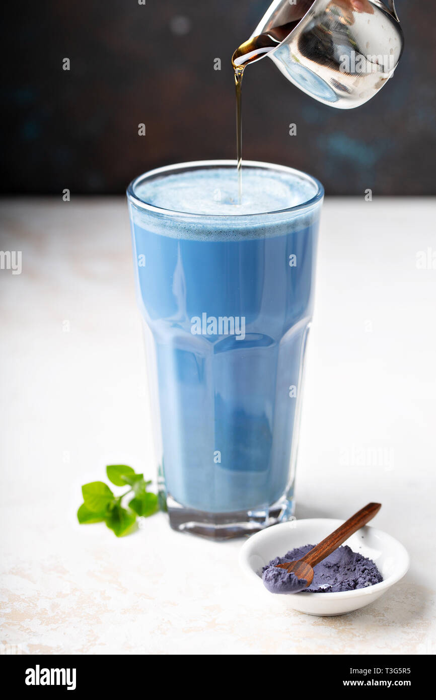 Blue matcha latte in tall glass Stock Photo - Alamy