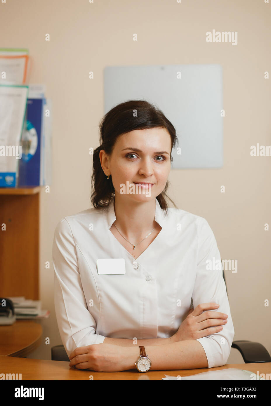 Attractive female doctor ophthalmologist keeping an appointment in