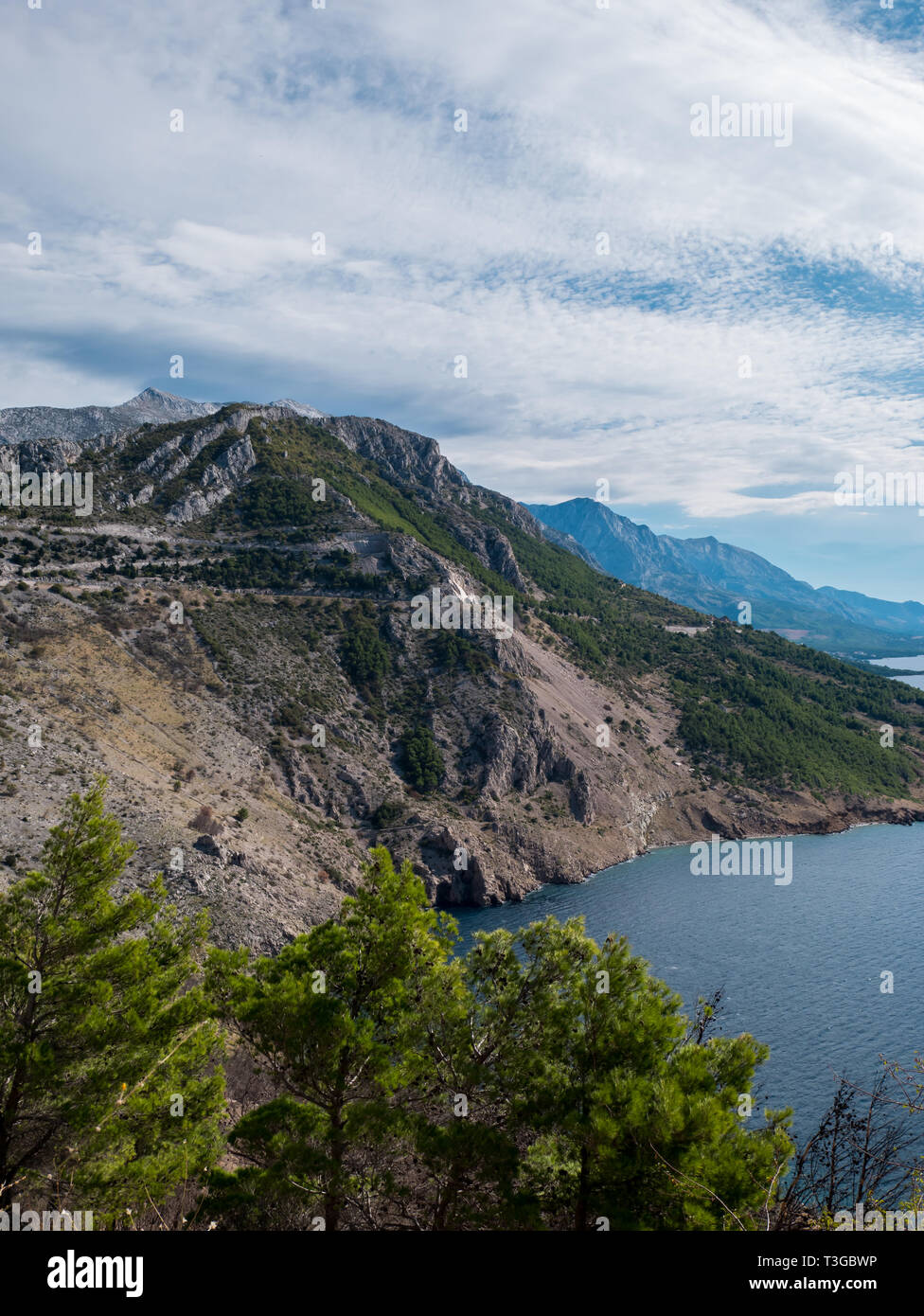 Rocky Mountains And Blue Sea On Makarska Riviera In Croatia Stock Photo rocky-mountains-and-blue-sea-on-makarska-riviera-in-croatia-stock-photo