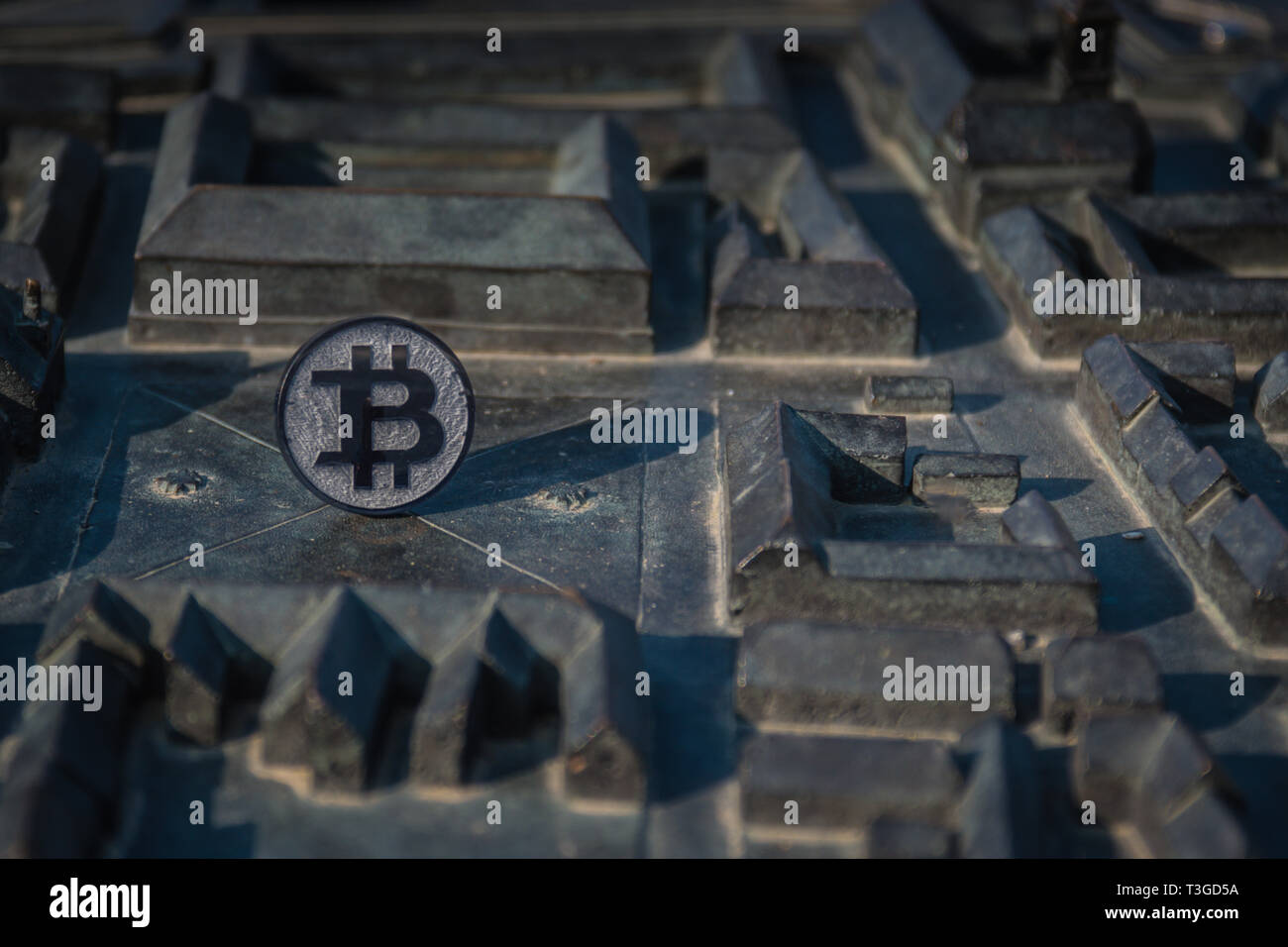 Custom Bit Bitcoin Made from black plastic custom bit coin on rustic old background Stock ...