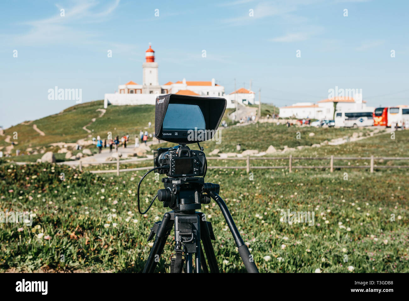 Portugal, Sintra, June 26, 2018: A close-up camera for a photo or a video camera for recording video from Nikon. Ahead is the lighthouse on Cape Roca Stock Photo