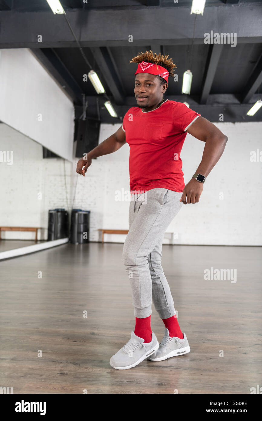Artistic hard working guy in grey sweatpants actively dancing Stock Photo Alamy