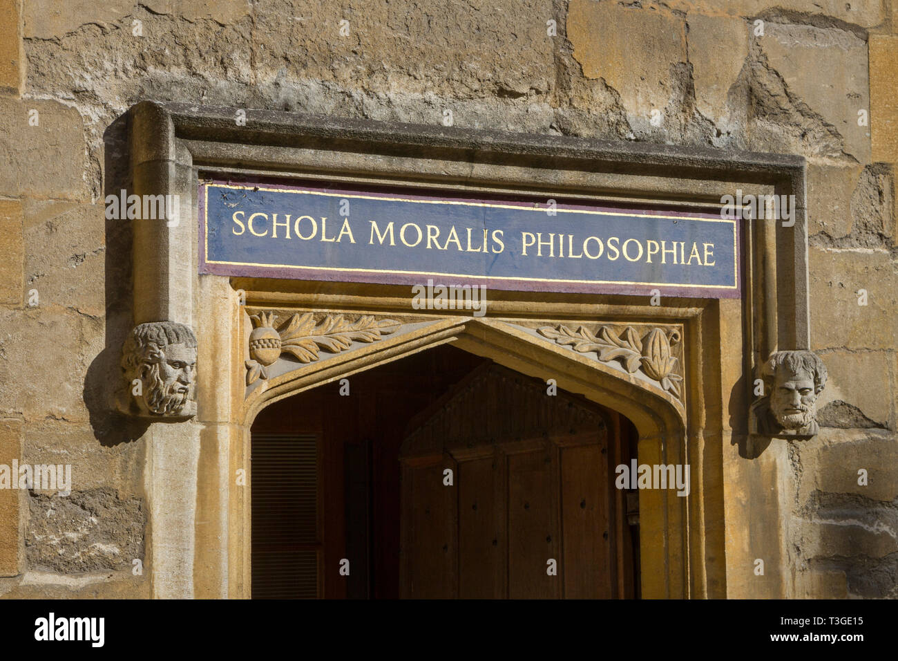 The inscription above a door to the Bodleian Library, Oxford 'Schola Moralis Philosophiae' in the Old Schools Quadrangle Stock Photo