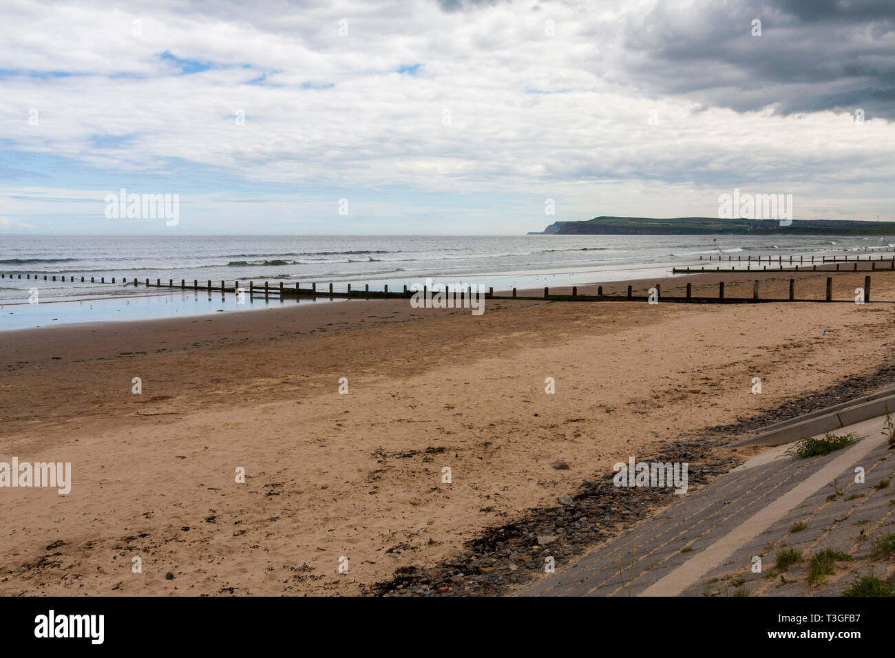 A view of the groins and incoming tide on the beach at Redcar in north east  England Stock Photo - Alamy