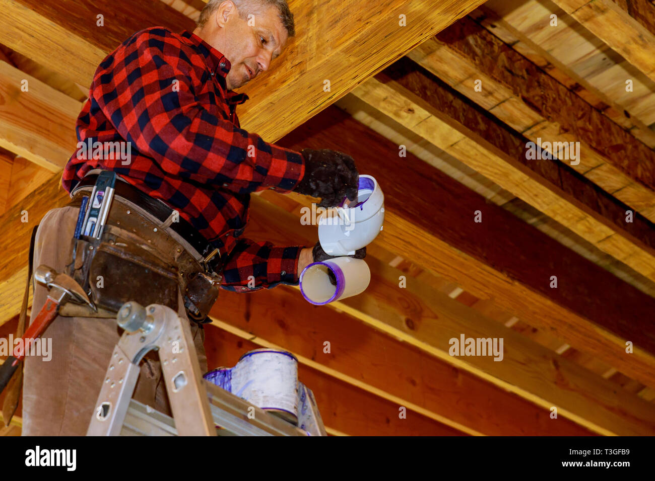 Pvc Connections Pipe Cement With Primer And Glue To Pvc Pipe Stock