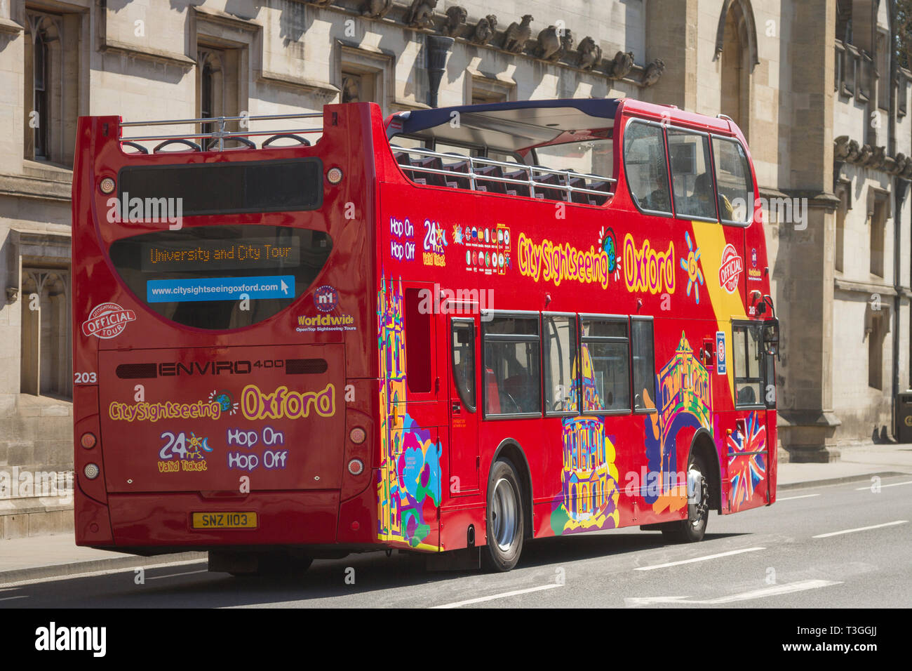 An open top, double-decker tour bus in the High Street, Oxford Stock Photo