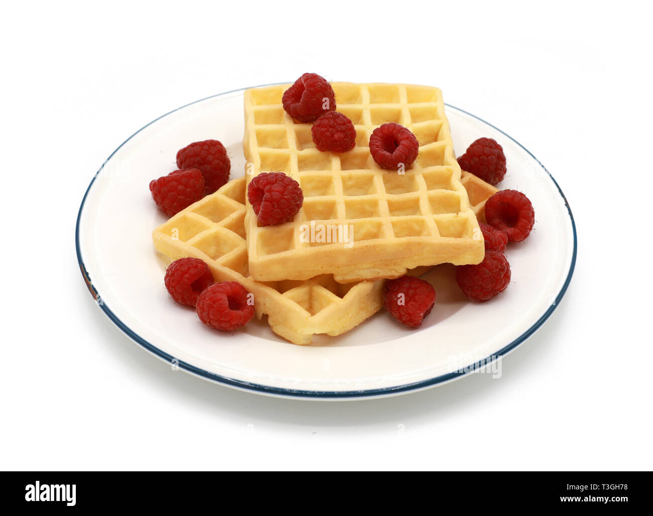 fresh belgian waffles with raspberrys on a plate isolated on white background Stock Photo