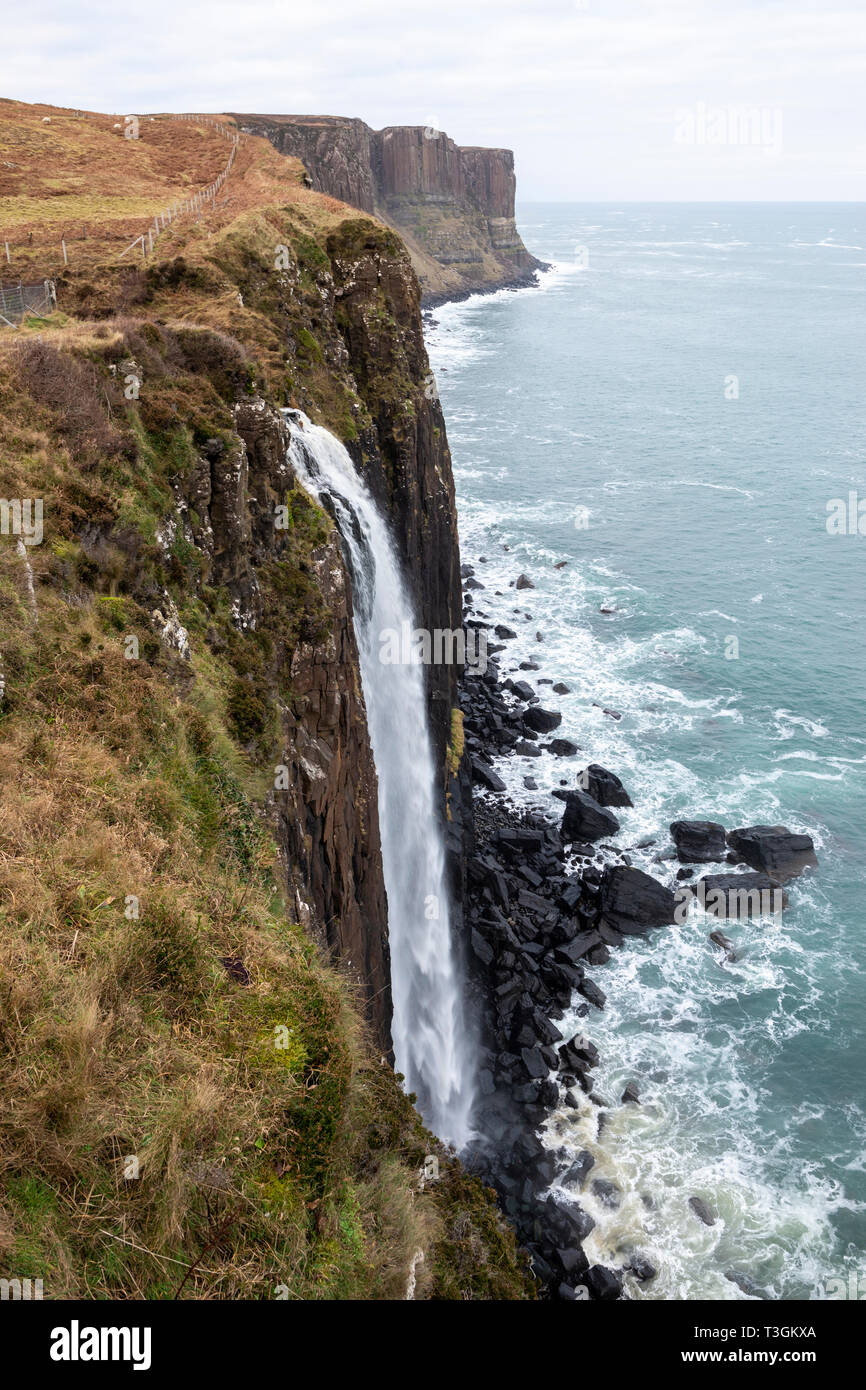 Mealt Falls with Kilt Rock sea-cliffs in background on east coast of Isle of Skye, Highland Region, Scotland, UK Stock Photo