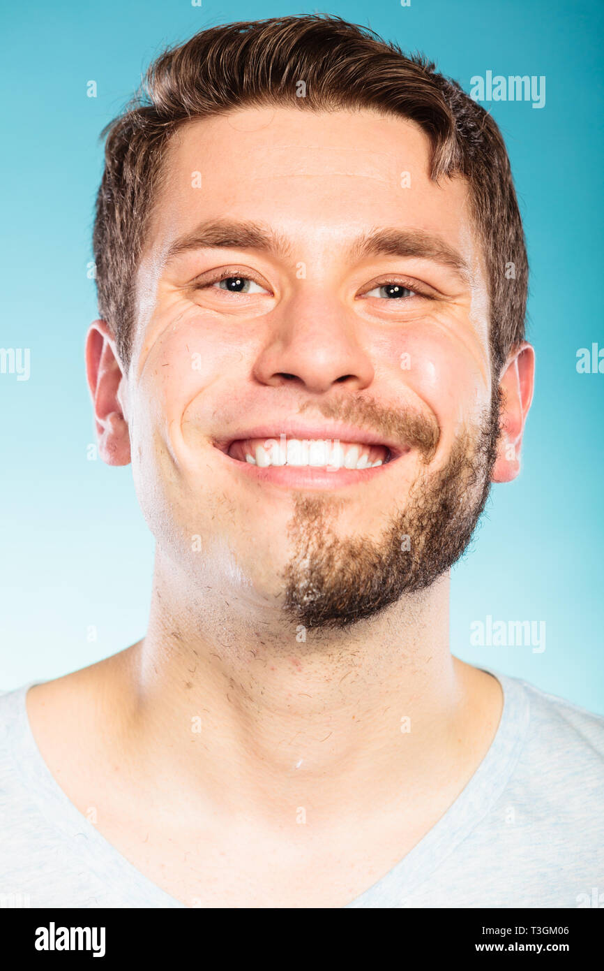 Portrait Of Happy Man With Half Shaved Face Beard Hair Smiling Handsome Guy On Blue Skin Care 6611