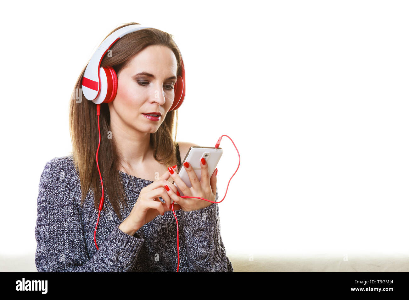 People leisure relax concept. Woman casual style red big headphones  listening music mp3 relaxing Stock Photo - Alamy