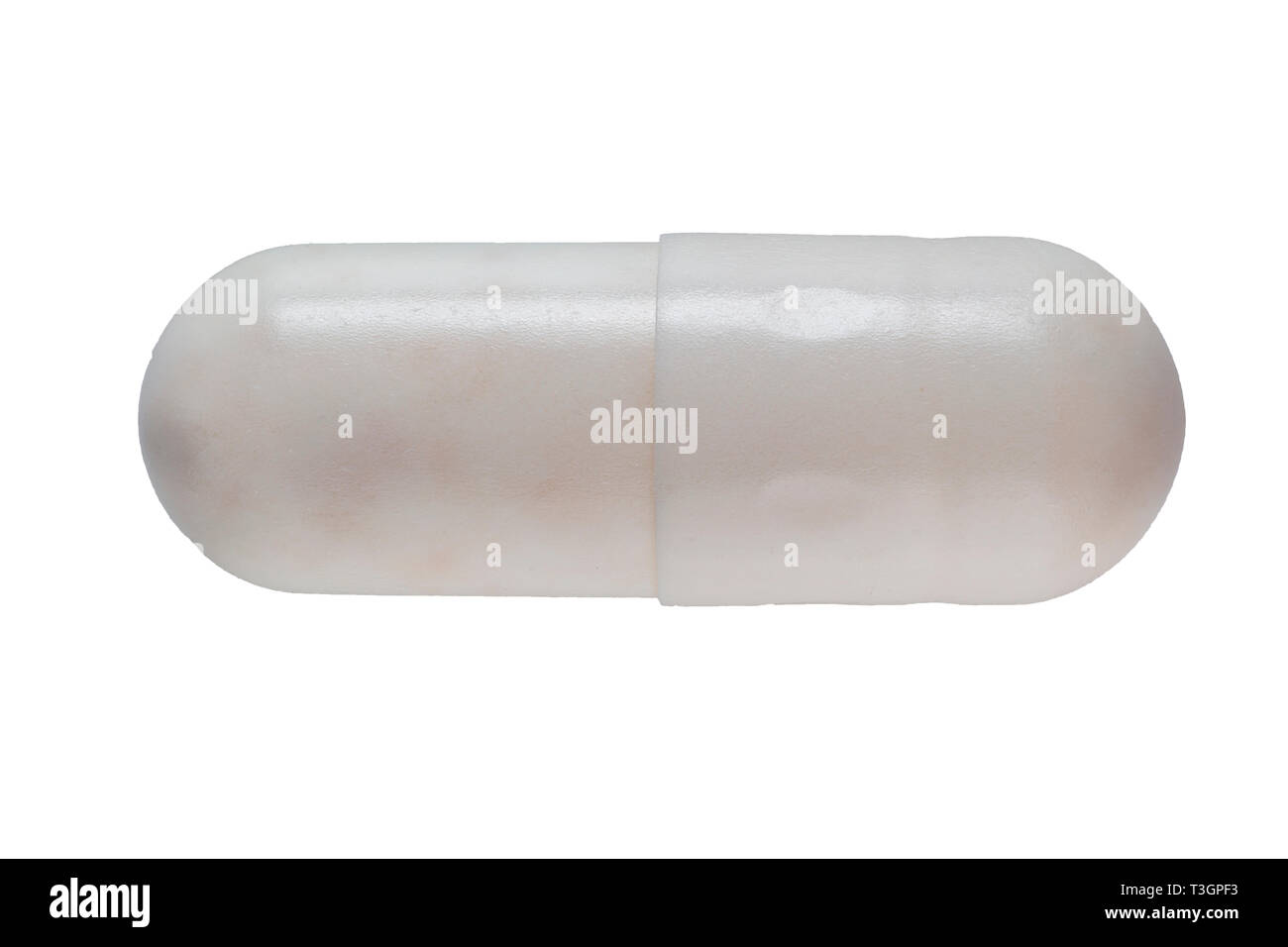 Extreme macro shot of a pill capsule showing the structure of the