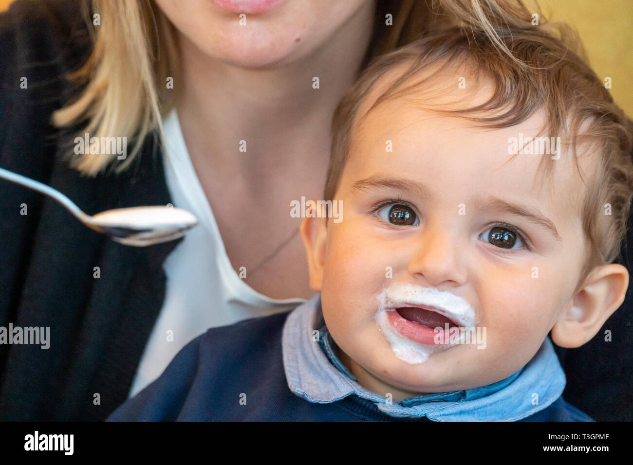 Very cute baby boy with milk mustache smiling at the camera Stock ...