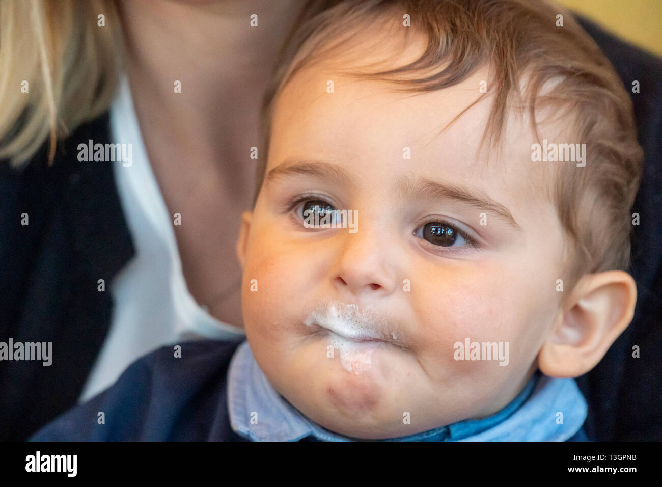 Very cute baby boy with milk mustache smiling at the camera Stock ...