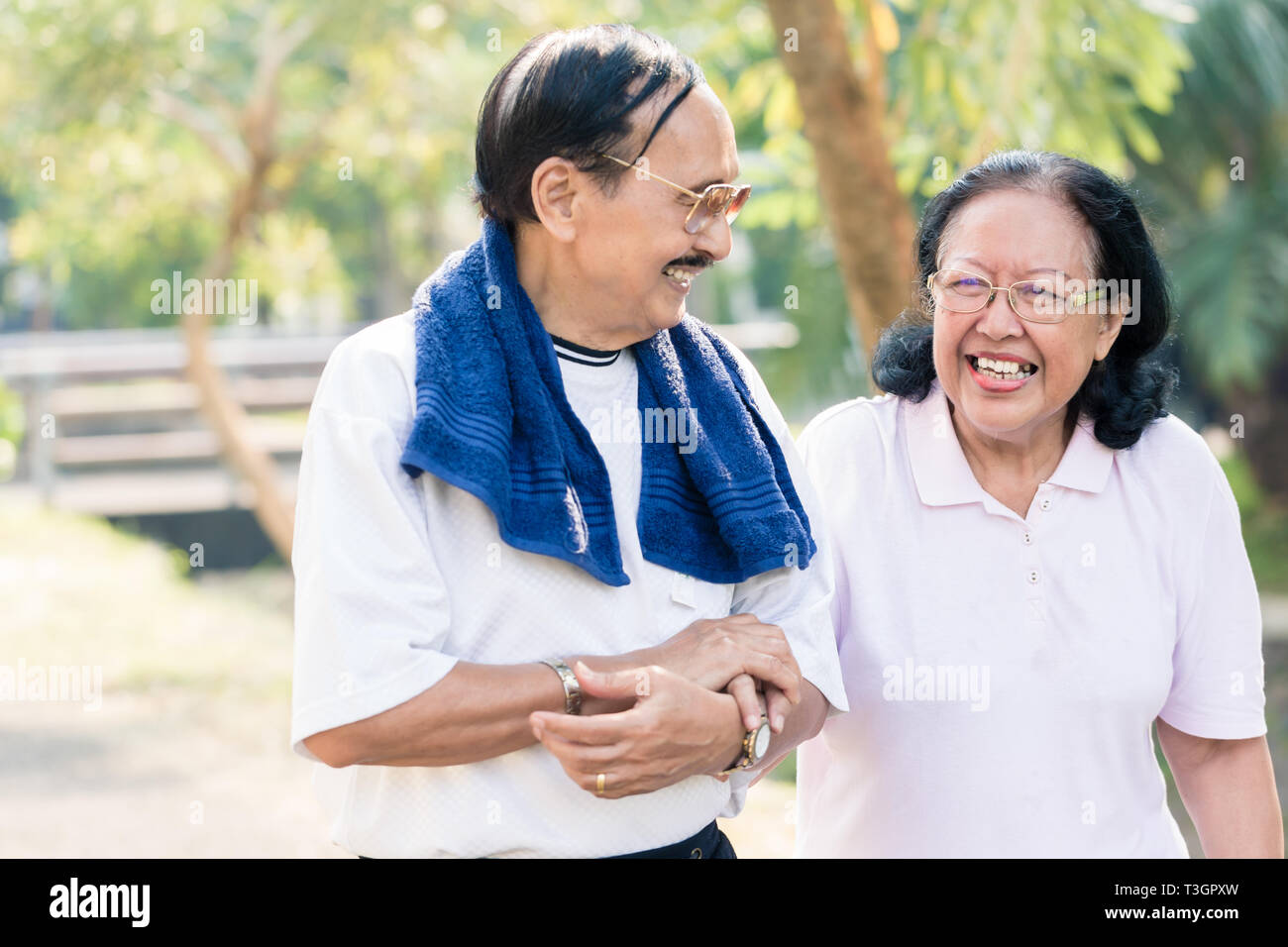 Old couple walking hand in hand hi-res stock photography and images - Alamy