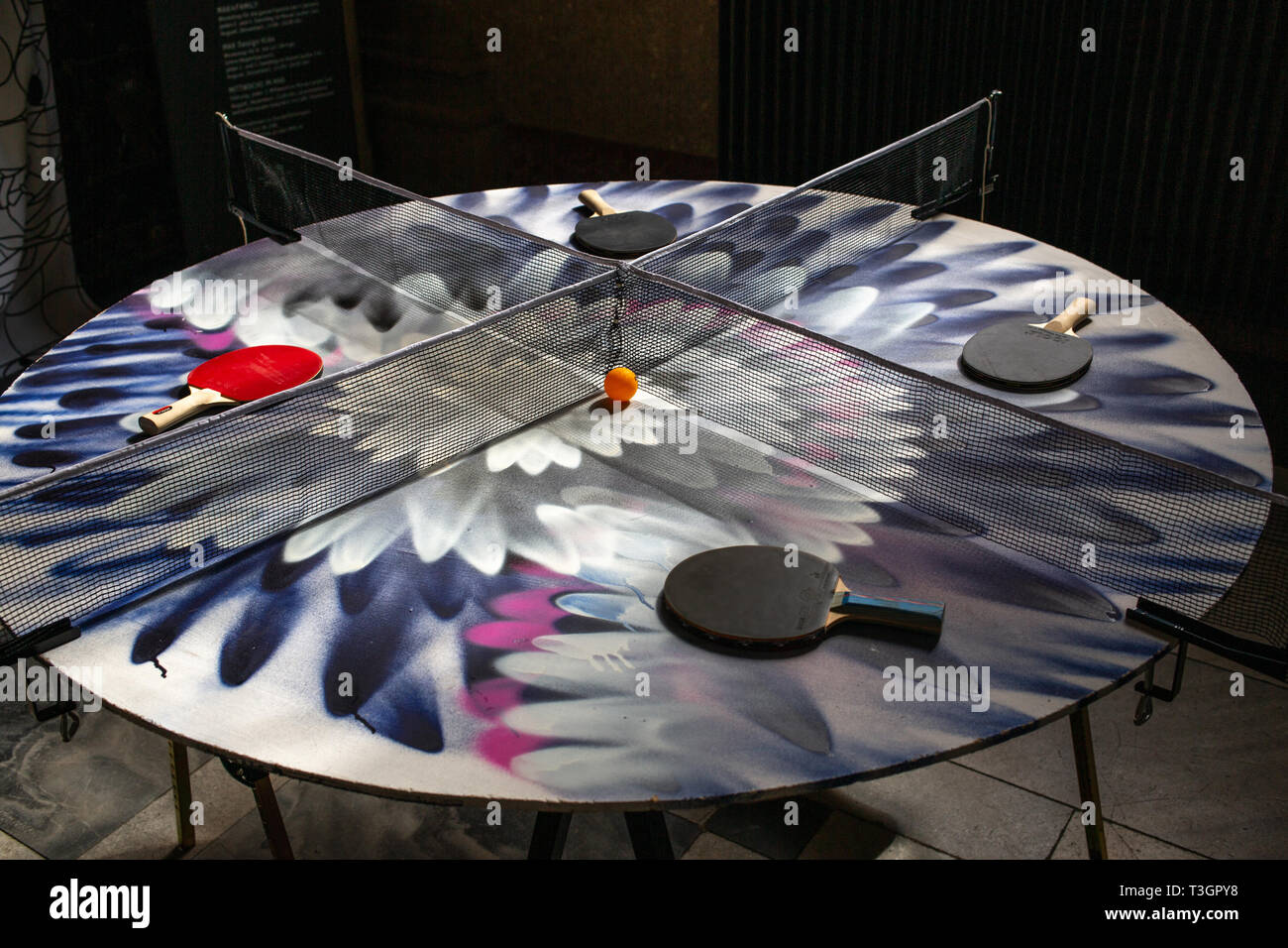 Table Tennis table with four (4) players Stock Photo