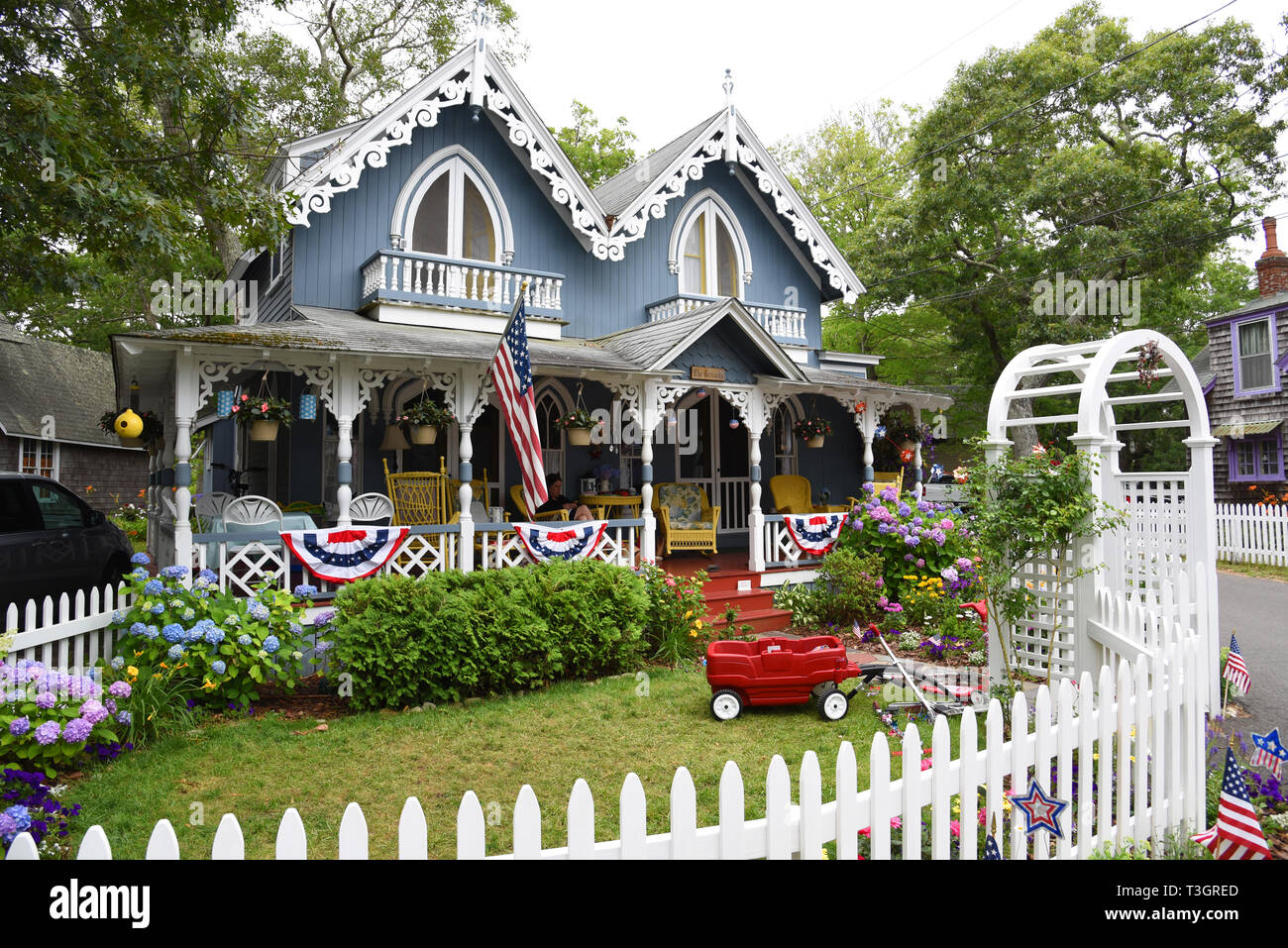 Carpenter Gothic Cottages with Victorian style, gingerbread trim in Wesleyan Grove, town of Oak Bluffs on Martha's Vineyard, Massachusetts, USA. Stock Photo